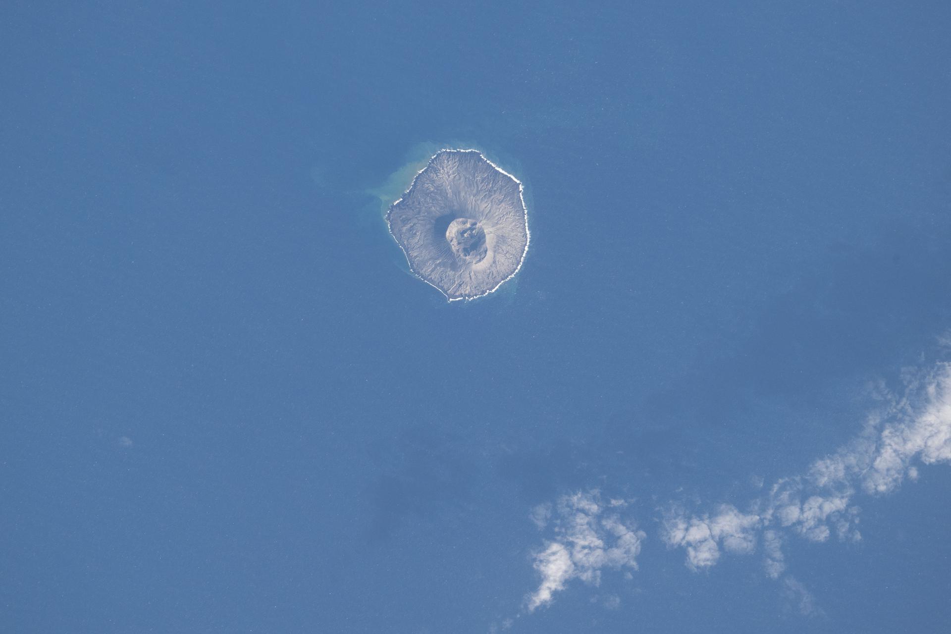 Nishinoshima Island, part of Japan's Volcano Islands chain and located about 600 miles south of Tokyo in the Pacific Ocean, is being created and expanded by volcanic activity such as magma mixing and periodic eruptions. The International Space Station was orbiting 261 miles above the Earth at the time of this photograph.