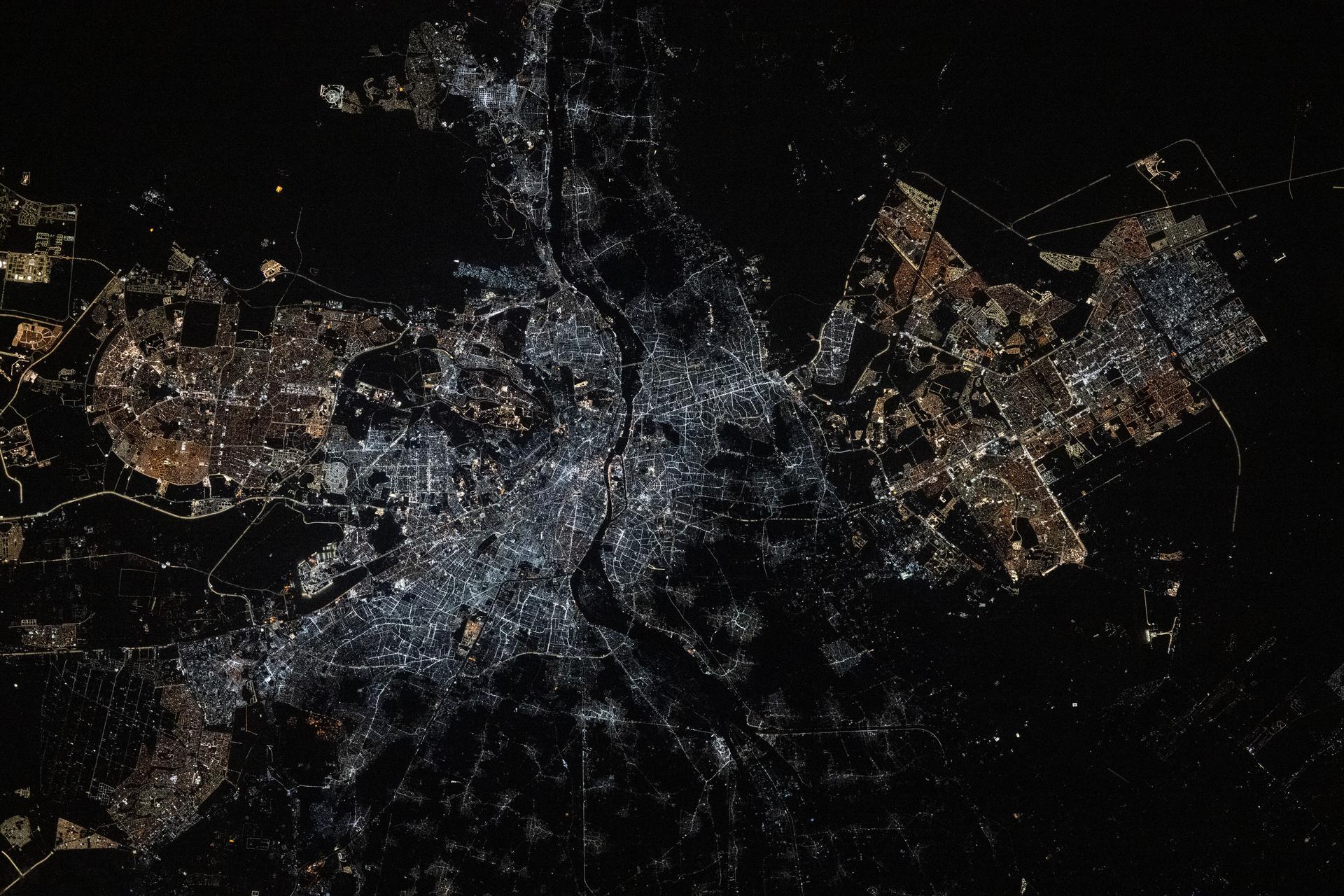 Egypt’s Cairo metropolitan area, with a population of about 22 million, is split by the Nile River and sits at the southern edge of the Nile Delta. At its center, Cairo and its major urban districts have undergone lighting upgrades, replacing older lamps with LED fixtures that emit bright white light. In contrast, Cairo’s suburban areas still use high-pressure sodium (HPS) lamps, which produce a warm amber glow. The International Space Station was orbiting 260 miles above Earth at approximately 9:09 p.m. local time when this photograph was taken.