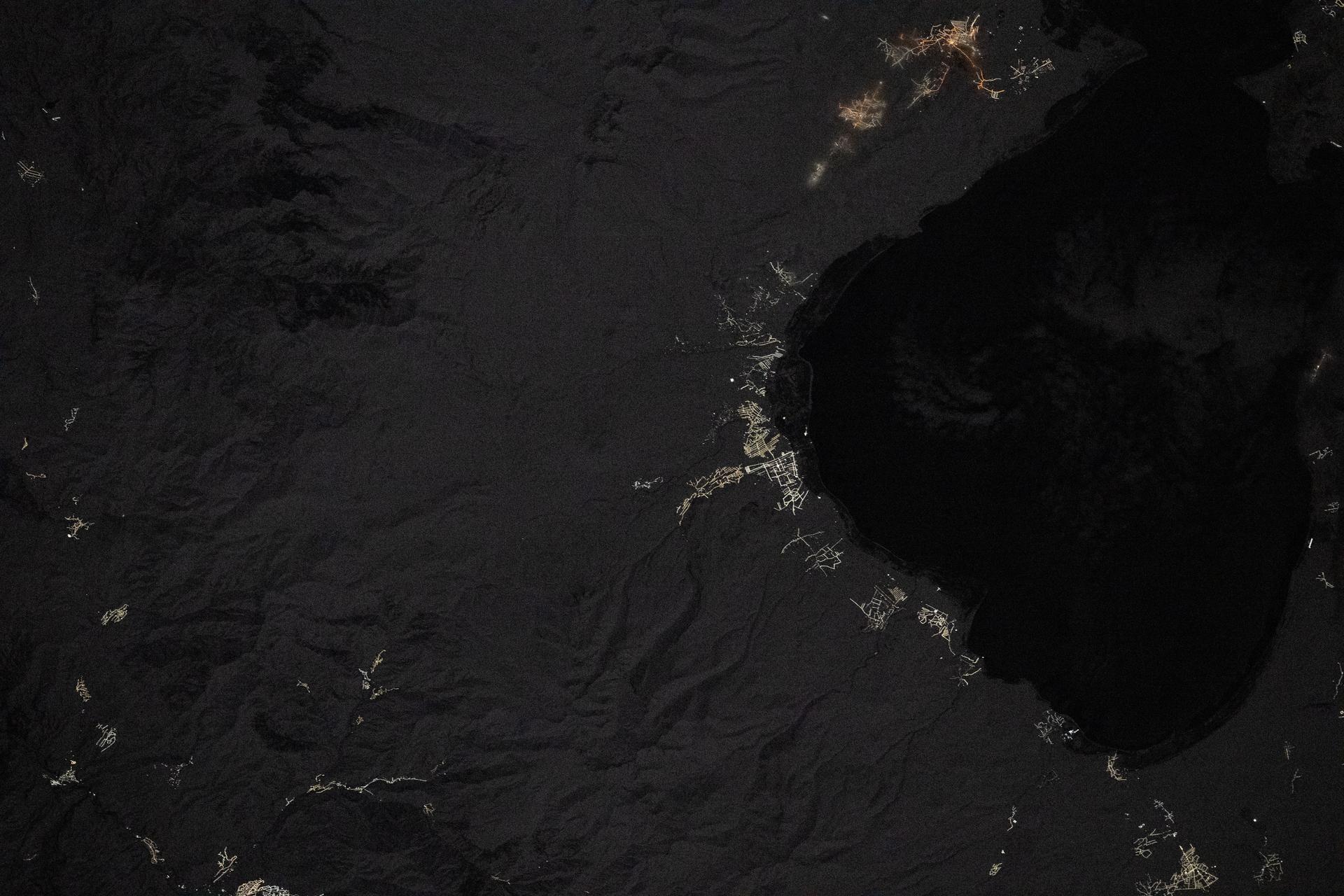 Villages light up the coastline in this nighttime image of Lake Sevan, one of the largest freshwater high-altitude lakes in the world, sitting at 1,900 meters above sea level in Armenia. Lake Sevan is protected as Sevan National Park for its ecological importance and for providing landlocked Armenia with most of its fish. The International Space Station was orbiting 262 miles above Earth at 11:13 p.m. local time when this photograph was taken.