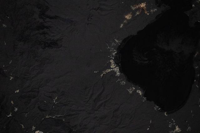 NASA image: Villages light up the coastline in this nighttime image of Lake Sevan