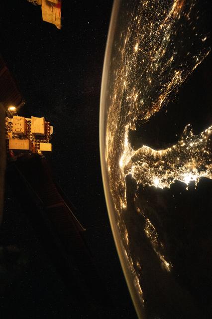 NASA image: The city lights of Italy sparkle from Naples to Genoa