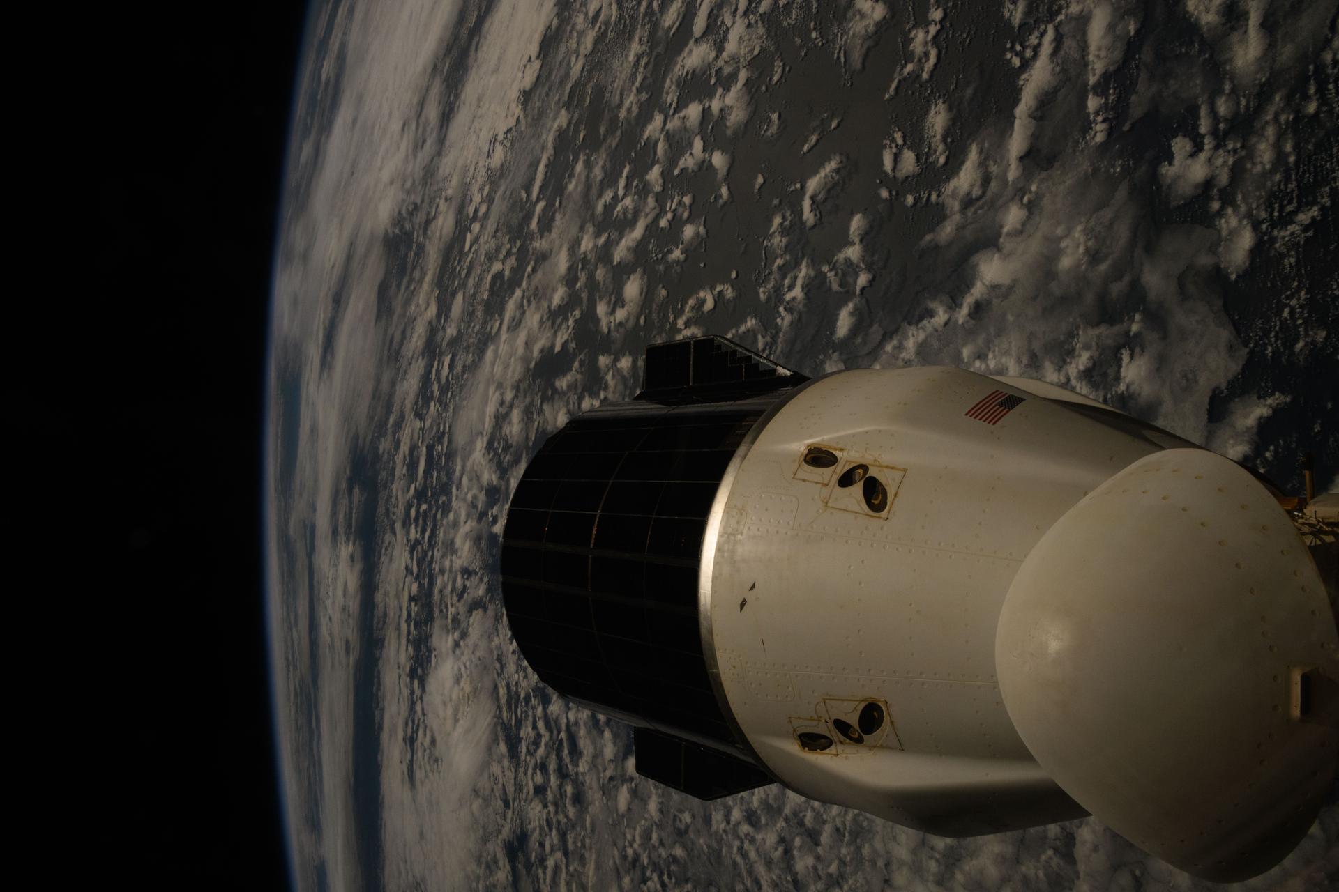 A SpaceX Dragon spacecraft is pictured docked to the International Space Station as the orbital outpost soared 269 miles above the Atlantic Ocean northwest of the South Georgia and the South Sandwich Islands.