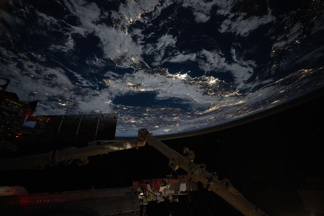 NASA image: City lights outline the boot of Italy