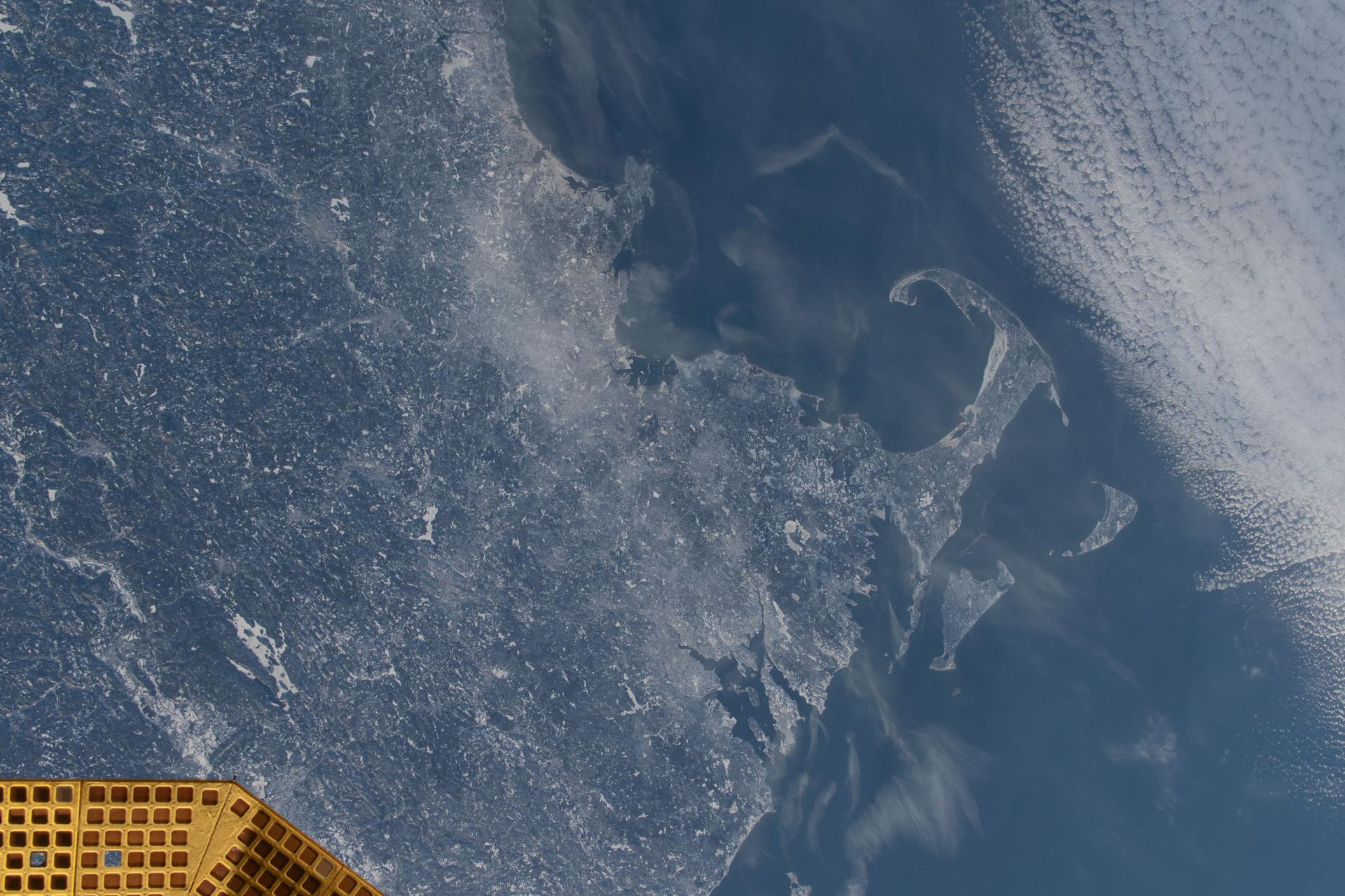 The wintry landscape of the southern New England region of the United States is seen from the International Space Station as it orbited 262 miles above North America. Temperatures in Boston, Massachussetts, ranged from a low of about 23 degrees Fahrenheit to a high of around 35 degrees when this photograph was taken.