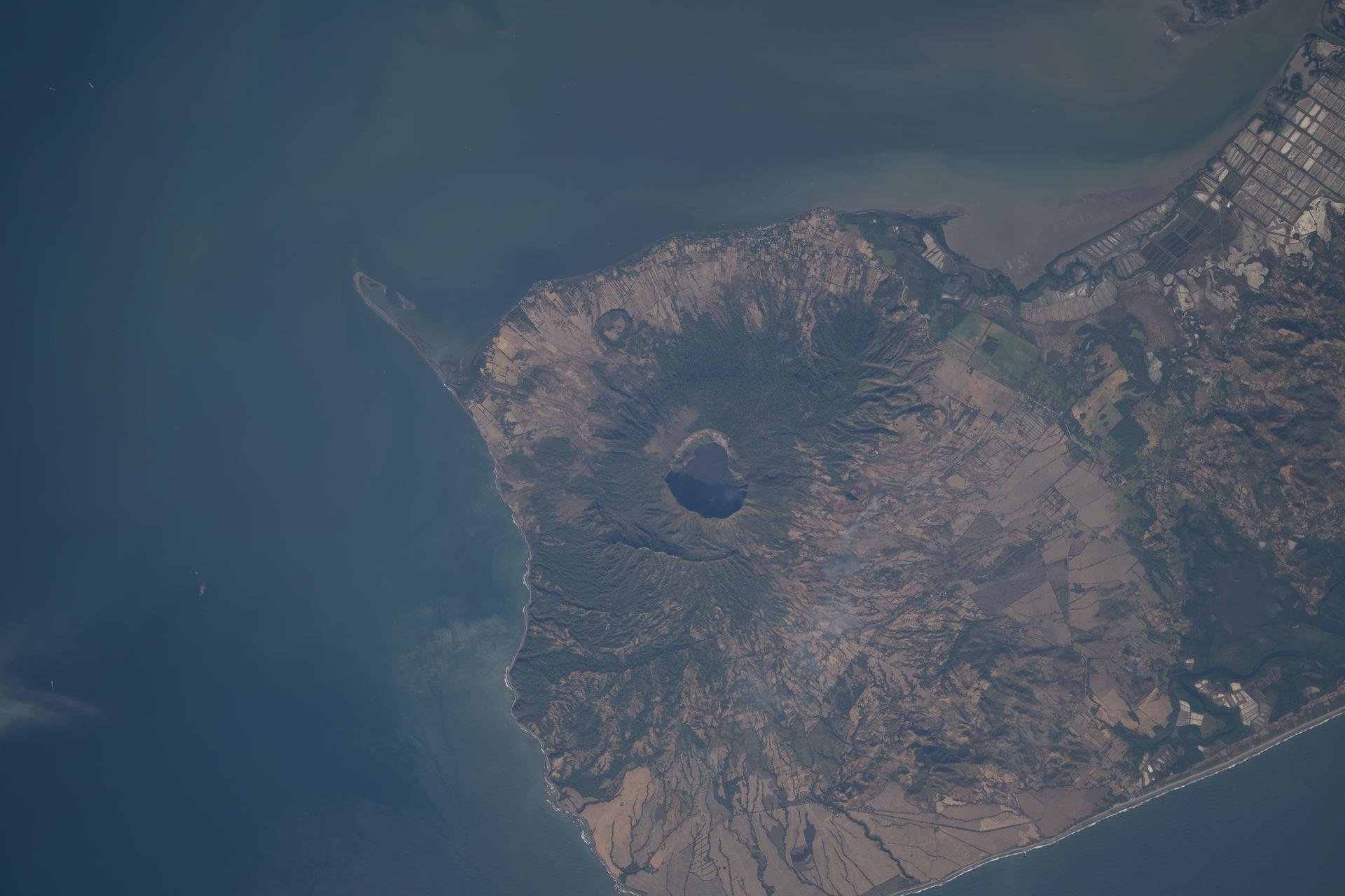 iss074e0312817 (Feb. 10, 2026) --- Cosigüina Volcano—a geologically young volcano, several thousand years old, with its last major eruption occurring in 1835—sits where the Gulf of Fonseca meets the Pacific Ocean in northwestern Nicaragua. The International Space Station was orbiting 261 miles above Central America when this photograph was taken. Credit: NASA/Chris Williams