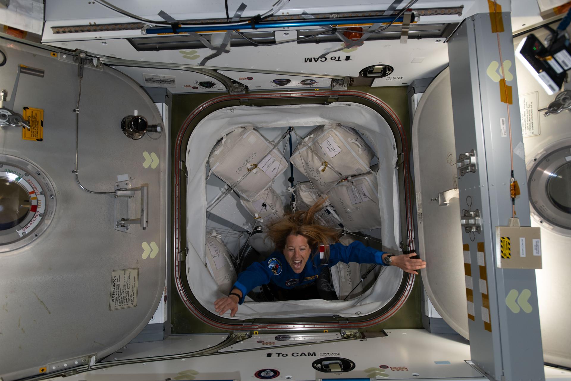iss074e0314129 (Feb. 14, 2026) --- ESA (European Space Agency) astronaut and SpaceX Crew-12 Mission Specialist Sophie Adenot enters the International Space Station after docking aboard the Dragon spacecraft to join Expedition 74 and begin a long-duration microgravity research mission. Credit: NASA/Chris Williams