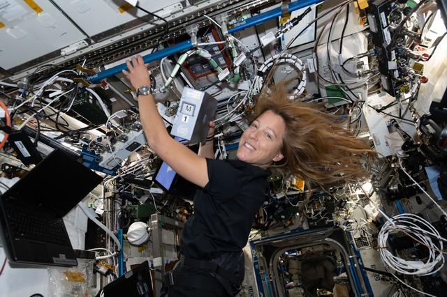NASA image: ESA astronaut Sophie Adenot swaps sample processing hard drives