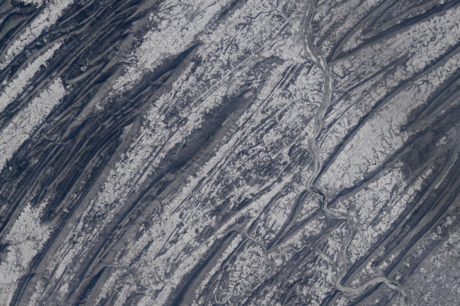 iss074e0315614 (Feb. 13, 2026) --- The icy Susquehanna River merges with the Juniata River as it flows across the wintry landscape of Pennsylvania’s Ridge-and-Valley Appalachians. This geological structure was formed from folded sedimentary rock and erosion patterns roughly 250 to 480 million years ago during the late Paleozoic Era. The International Space Station was orbiting 260 miles above the Keystone State when this photograph was taken. Credit: NASA/Chris Williams