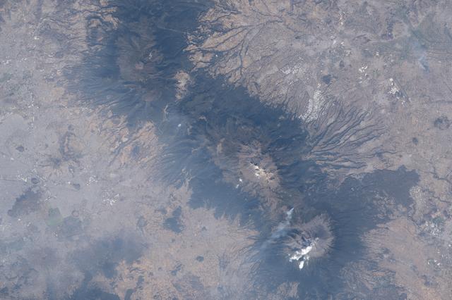 NASA image: The three prominent mountaintops just east of Mexico City
