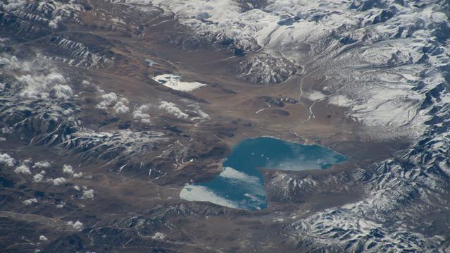 NASA image: Peiku Lake in southwest China is surrounded by Himalayan peaks