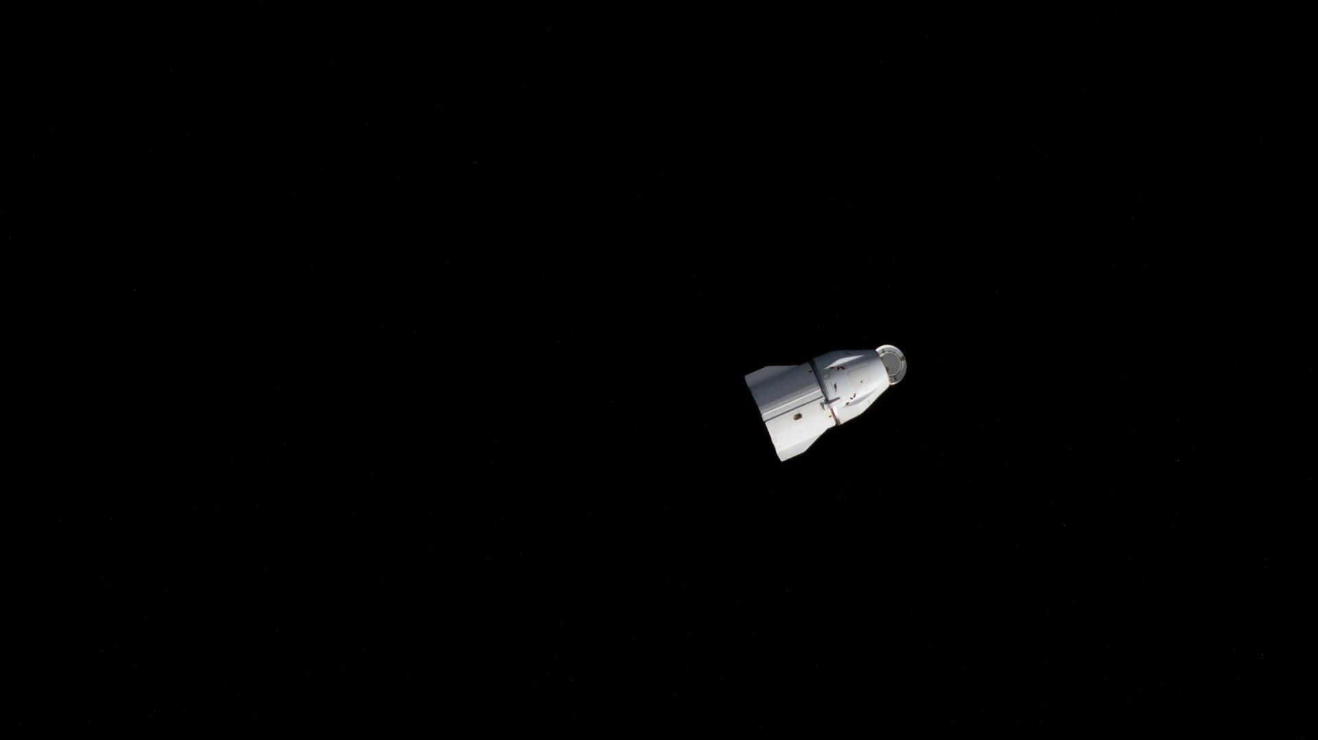 A SpaceX Dragon spacecraft departs the International Space Station carrying several thousand pounds of science experiments and lab hardware for return and analysis on Earth. Dragon completed a six-month stay attached to the Harmony module's forward port where it docked in August of 2025 delivering over 5,500 pounds of new science, supplies, and hardware to resupply the orbital residents.