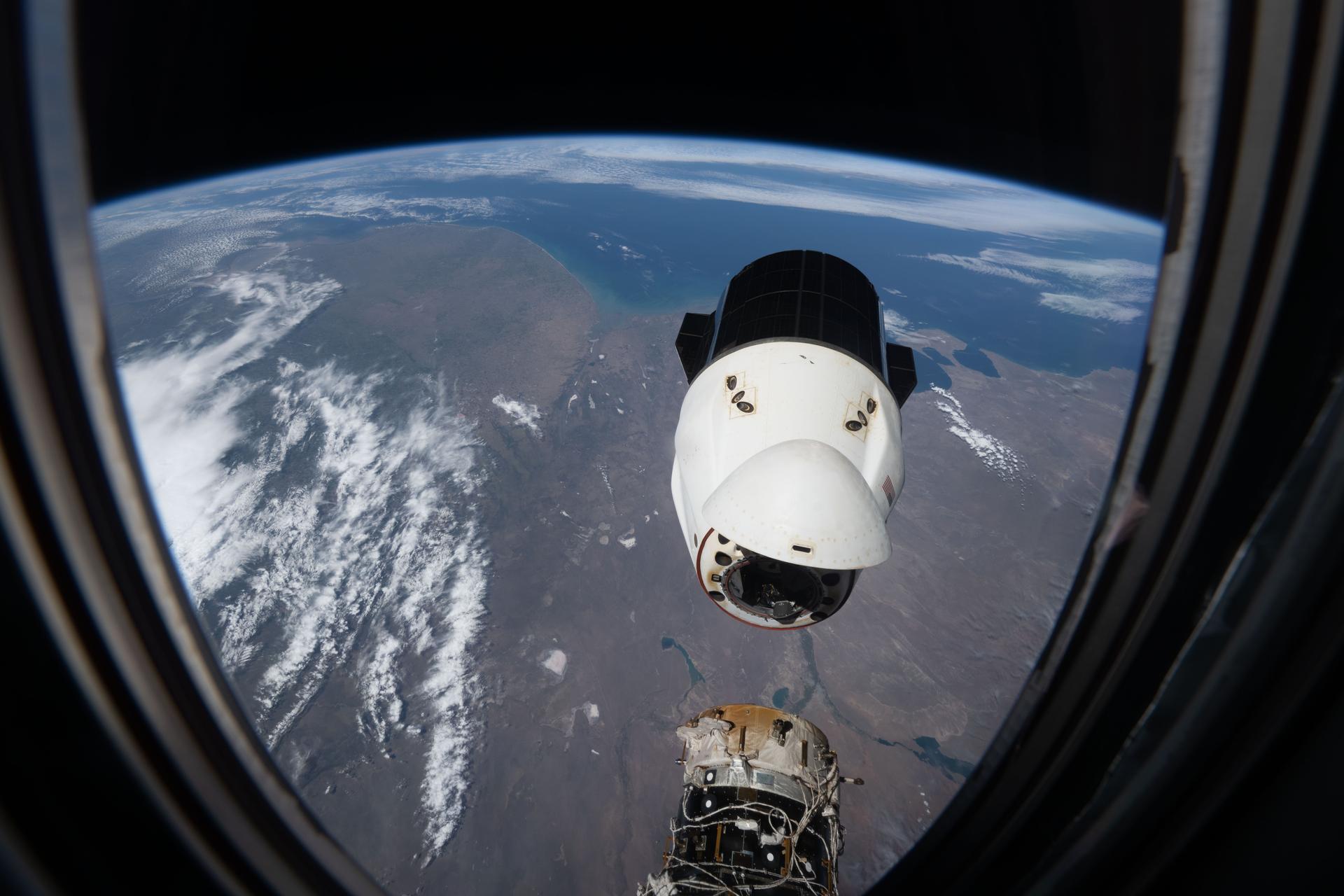 A SpaceX Dragon spacecraft, packed with several tons of science experiments and lab hardware, backs away from the Harmony module’s forward port shortly after undocking from the International Space Station. The orbital outpost was soaring 271 miles above Argentina’s Atlantic coast at the time of this photograph. Dragon splashed down several hours later in the Pacific Ocean off the coast of San Diego, California, where it was retrieved by NASA and SpaceX personnel.
