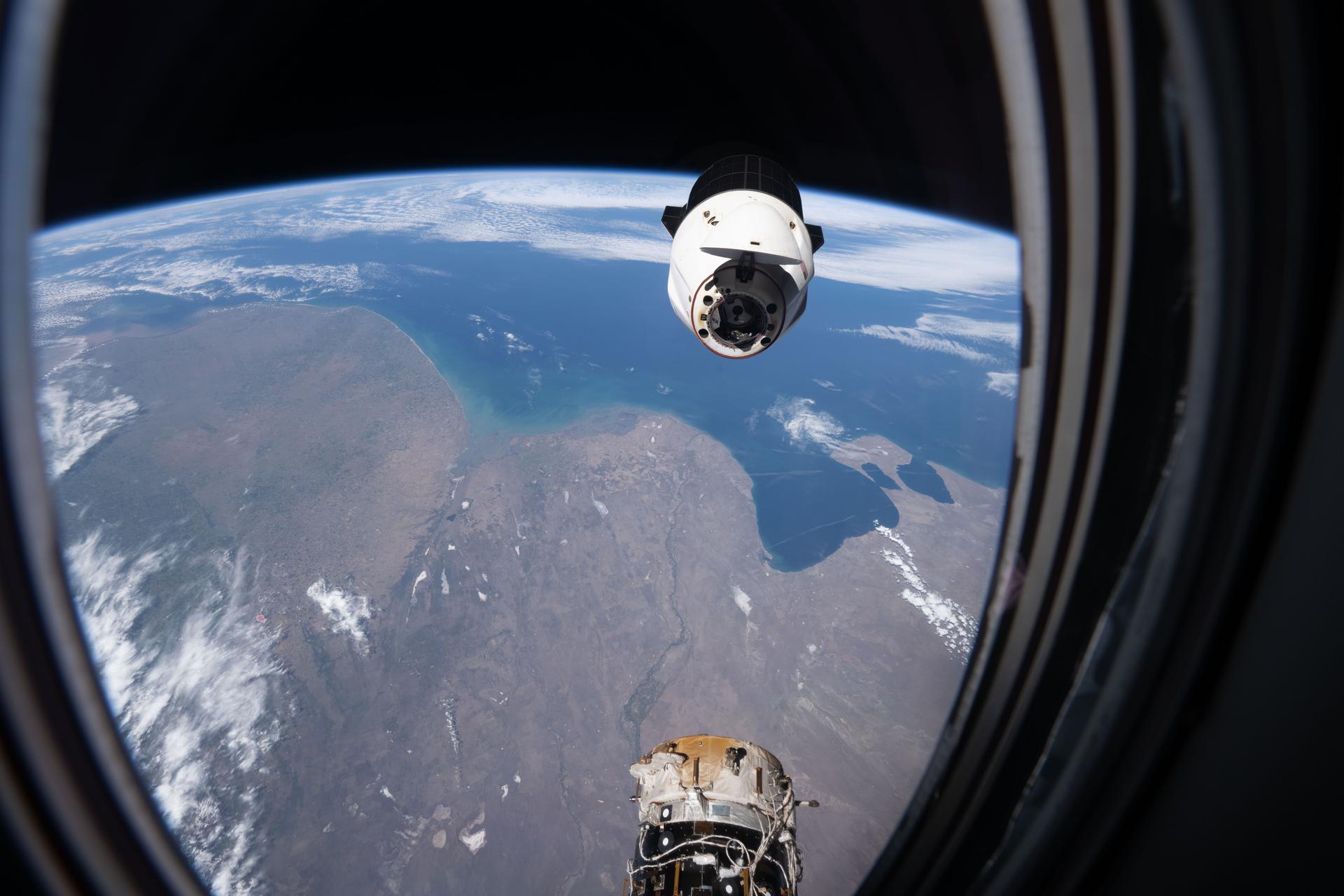 A SpaceX Dragon spacecraft, packed with several tons of science experiments and lab hardware, backs away from the Harmony module’s forward port shortly after undocking from the International Space Station. The orbital outpost was soaring 271 miles above Argentina’s Atlantic coast at the time of this photograph. Dragon splashed down several hours later in the Pacific Ocean off the coast of San Diego, California, where it was retrieved by NASA and SpaceX personnel.
