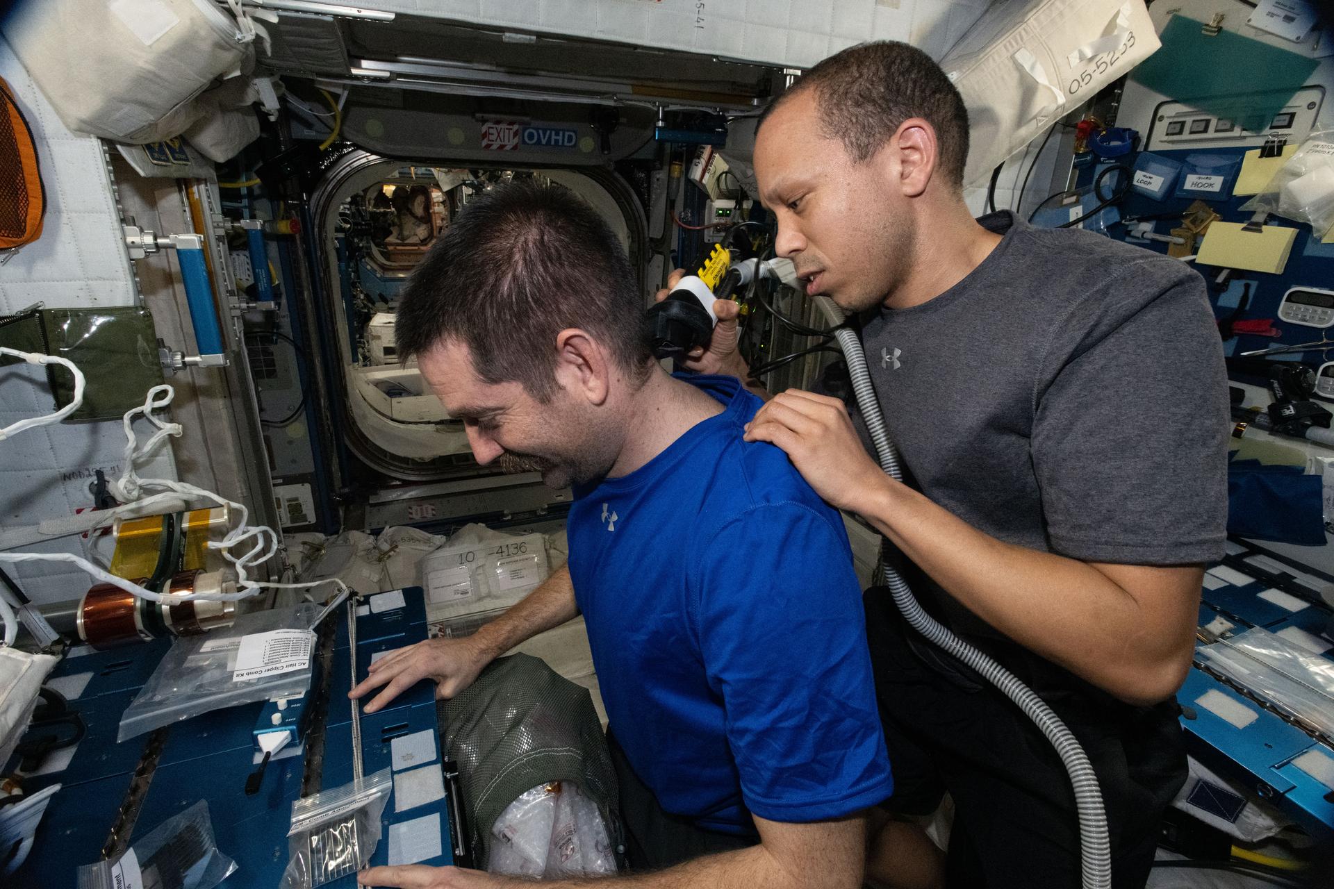 eekends on the International Space Station are for housecleaning and haircuts. NASA astronaut Chris Williams trims the hair of fellow NASA astronaut Jack Hathaway, both Expedition 74 flight engineers, using an electric razor attached to a vacuum that collects loose clippings to keep the station’s atmosphere clean in microgravity.