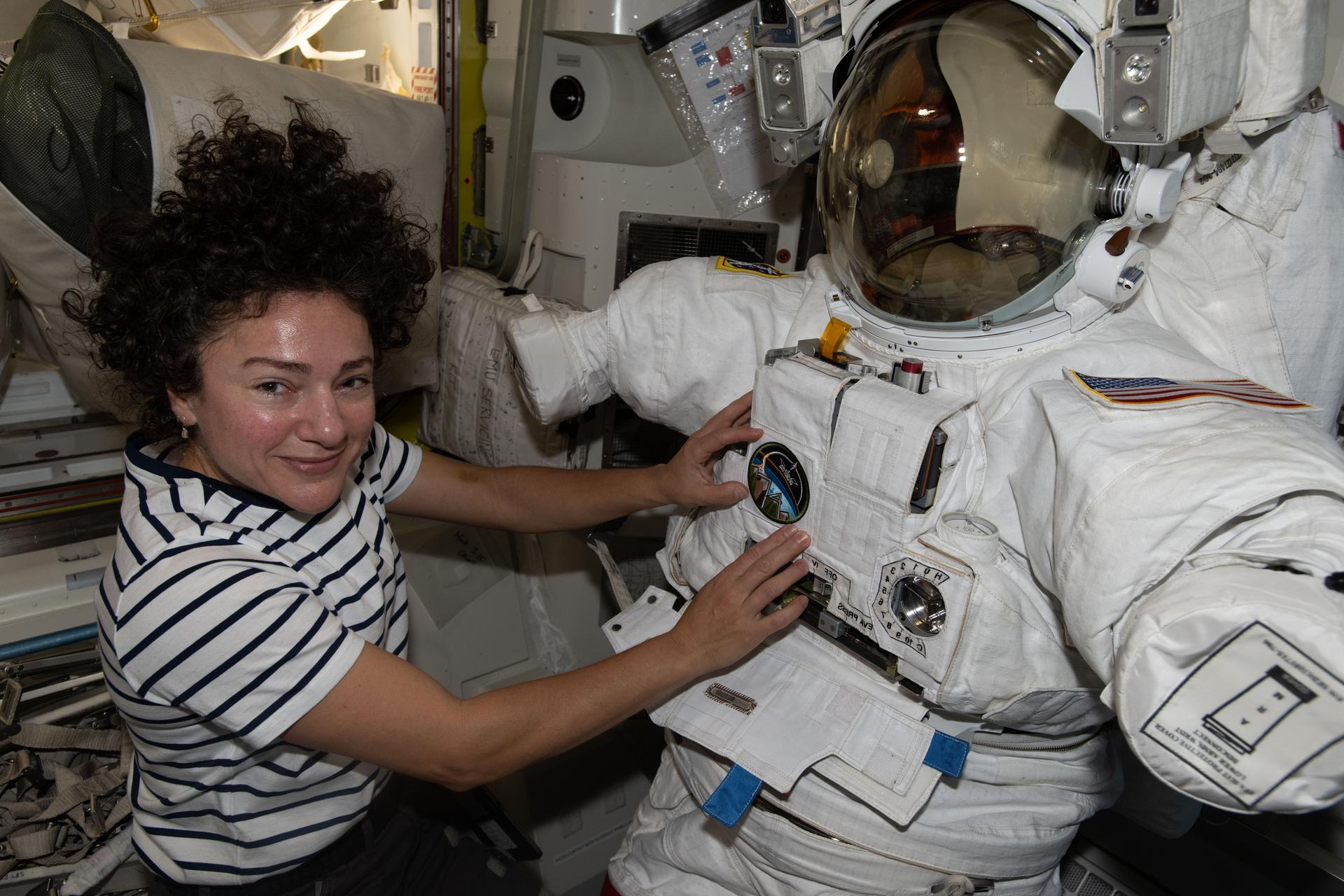 NASA astronaut and Expedition 74 flight engineer Jessica Meir works inside the International Space Station's Quest airlock, installing leg and arm components on a spacesuit and swapping components from one suit to another.