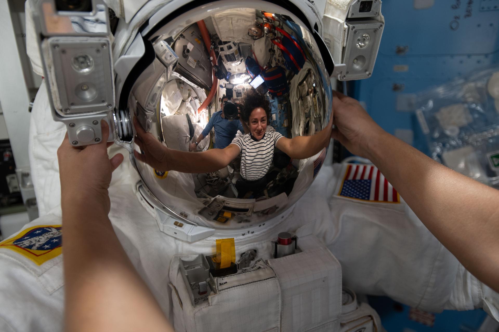 NASA astronaut and Expedition 74 flight engineer Jessica Meir’s reflection is captured in a spacesuit helmet visor. The visor assembly is coated with a microscopic layer of gold that reflects infrared radiation to protect an astronaut’s eyes while allowing visible light to pass through. Meir was working inside the International Space Station's Quest airlock, installing leg and arm components on the spacesuit and swapping components from one suit to another.