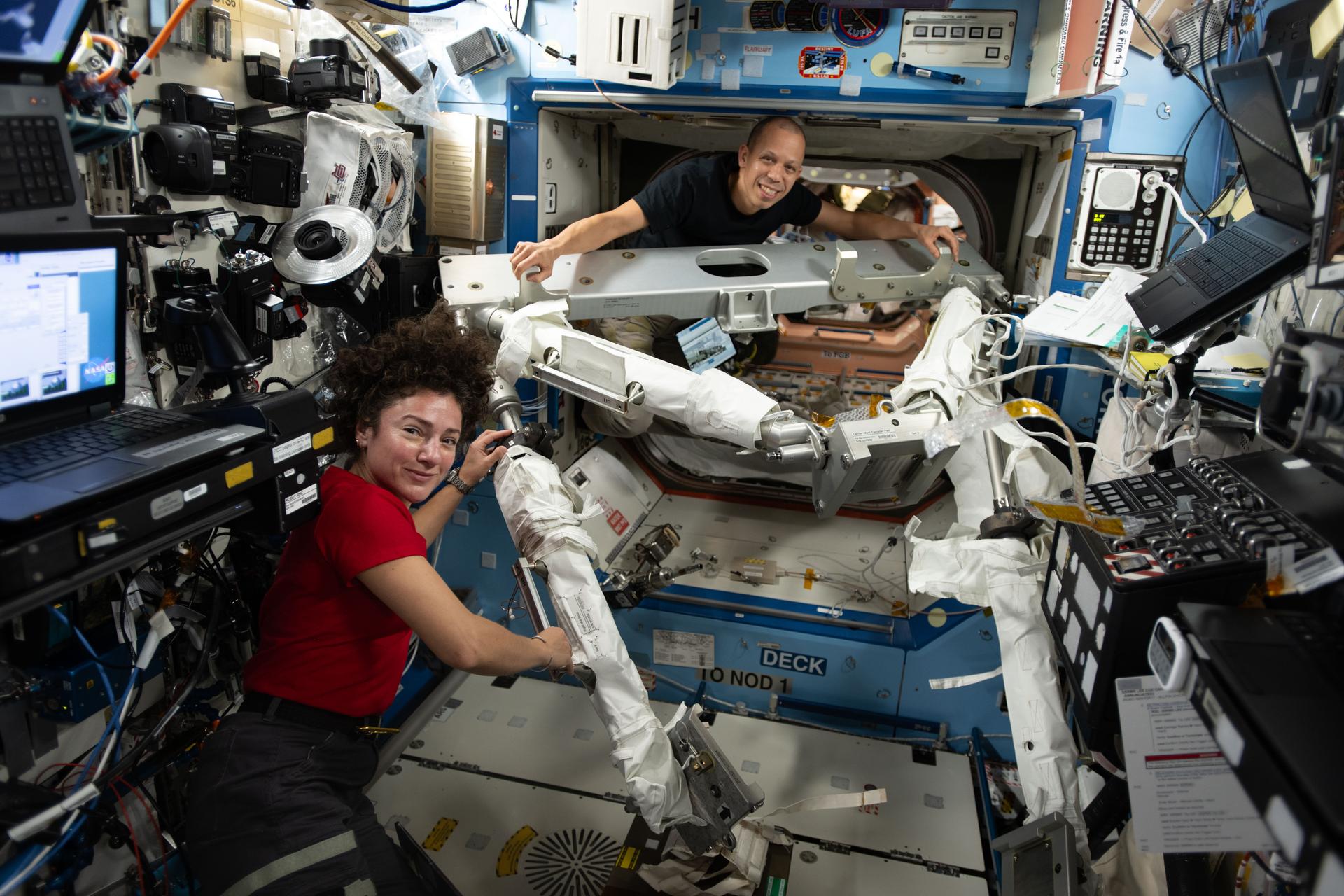 NASA astronauts Jessica Meir and Chris Williams, both Expedition 74 flight engineers, familiarize themselves with the hardware they will use to install a modification kit and route cables on the port side of the International Space Station. The duo will conduct a spacewalk using the hardware to prepare the orbital outpost for a future roll‑out solar array that will be installed during a later spacewalk.