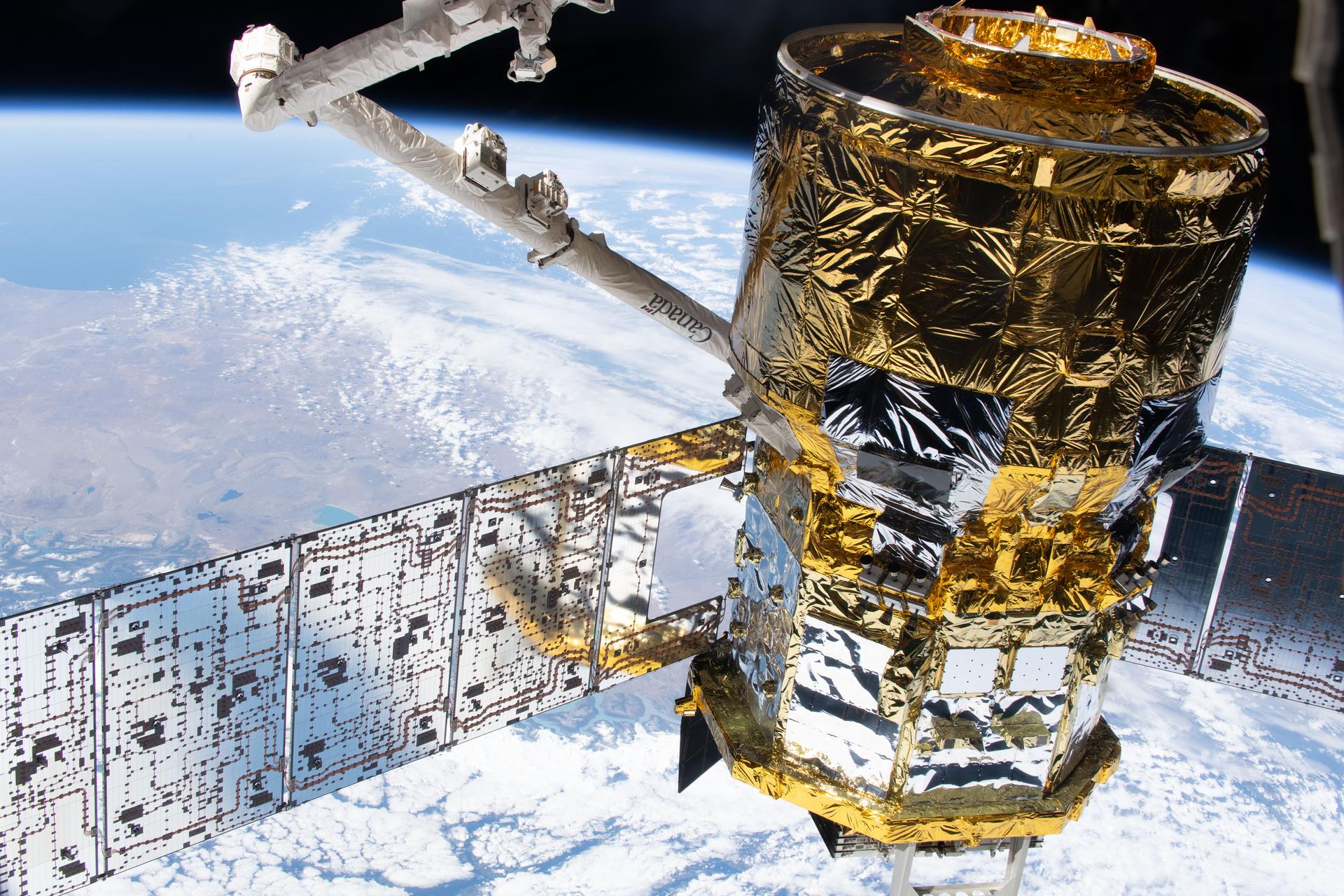 The HTV‑X1 cargo spacecraft from JAXA (Japan Aerospace Exploration Agency) is in the grasp of the Canadarm2 robotic arm after being detached from the Earth‑facing port of the International Space Station’s Harmony module. The orbital outpost was soaring 274 miles above the Pacific Ocean off the coast of South America’s Patagonia region at the time of this photograph.