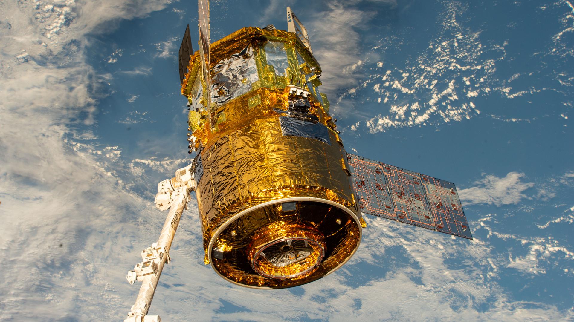 The HTV‑X1 cargo spacecraft from JAXA is grasped by the Canadarm2 robotic arm