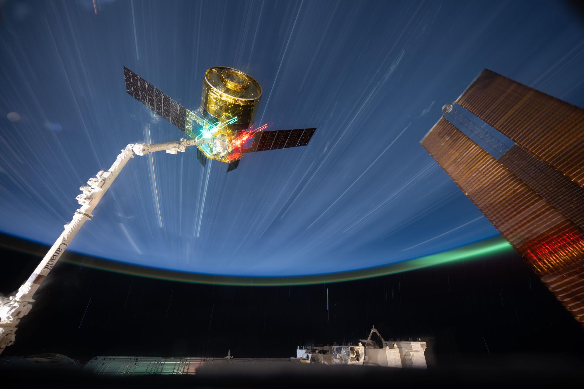 The HTV‑X1 cargo spacecraft from JAXA (Japan Aerospace Exploration Agency) is grasped by the Canadarm2 robotic arm in this long-duration photograph from the International Space Station as it orbited 265 miles above northeastern China. Moments later, Canadarm2 would release HTV‑X1 into Earth orbit, completing the spacecraft’s four‑month stay attached to the orbital outpost’s Harmony module.