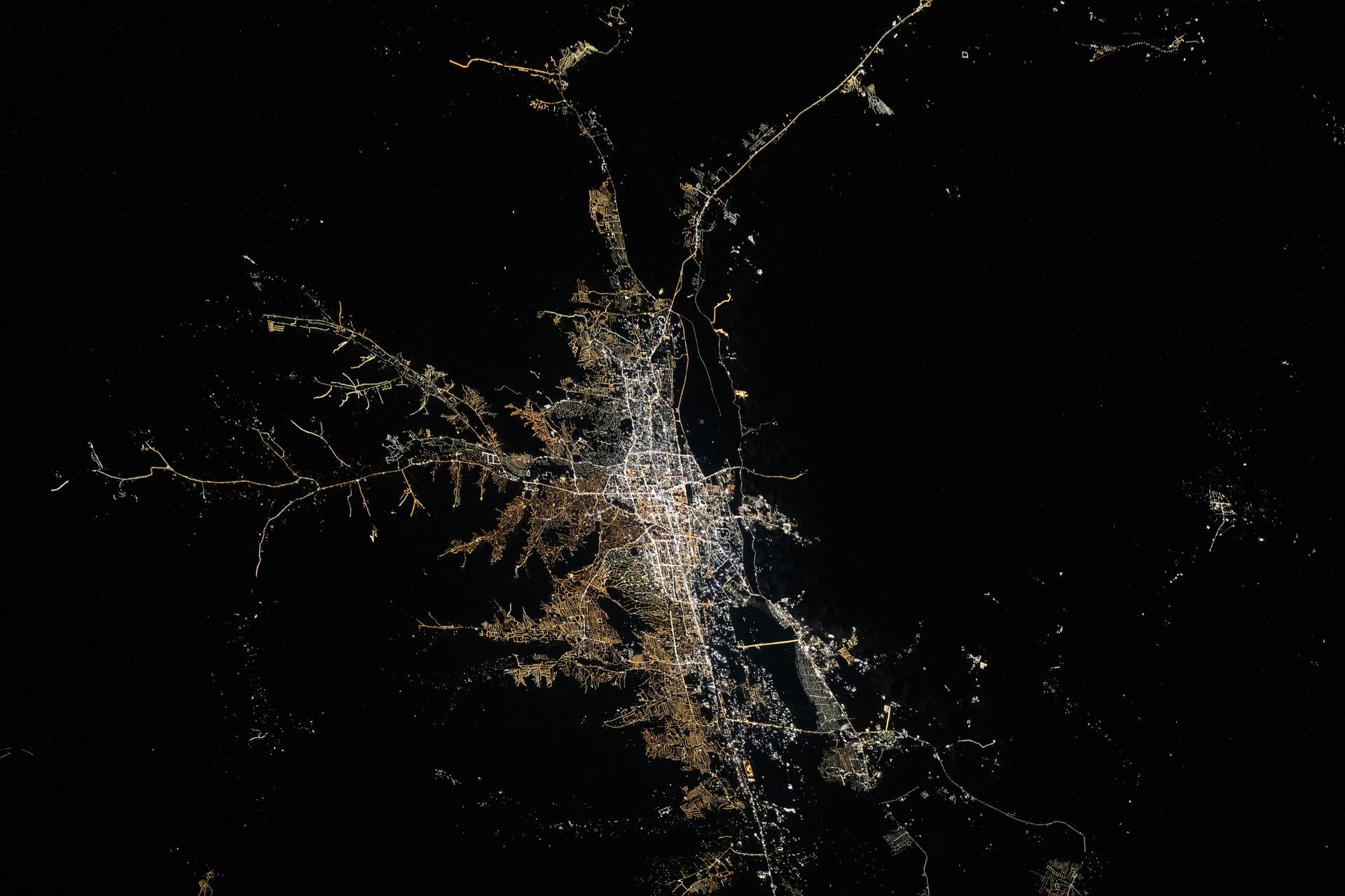 Mongolia's capital, Ulaanbaatar, with a population of about 1.7 million, sits on the high, semi-arid Mongolian Plateau and experiences extremely cold winters and short warm summers. This photograph was taken at approximately 12:42 a.m. local time from the International Space Station as it orbited 264 miles above Asia.