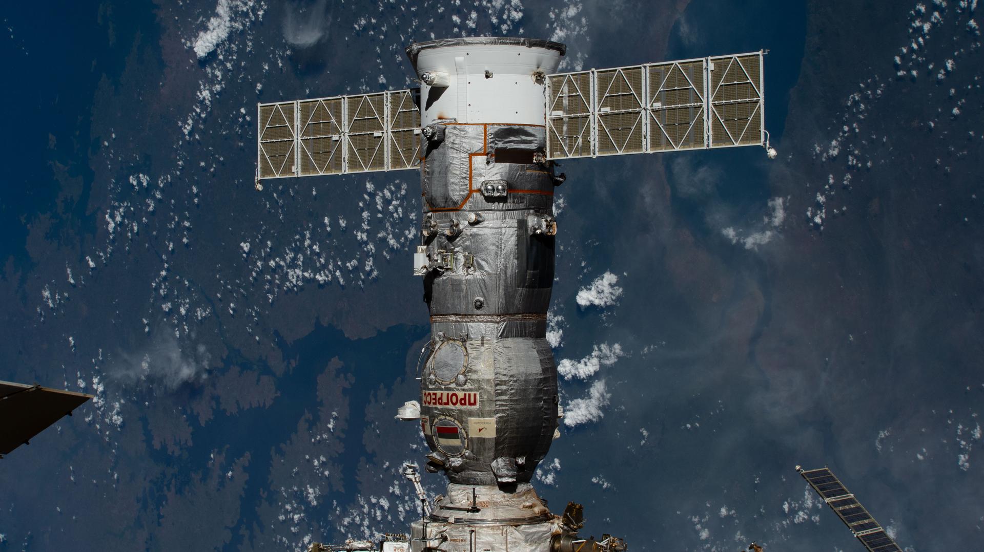 iss074e0381649 (March 16, 2026) --- The Progress 94 cargo spacecraft from Roscosmos, packed with about three tons of food, fuel, and supplies for the Expedition 74 crew, is pictured shortly after docking to the International Space Station's Poisk module. The orbital outpost was soaring 265 miles above the Democratic Republic of the Congo at the time of this photograph. Credit: NASA