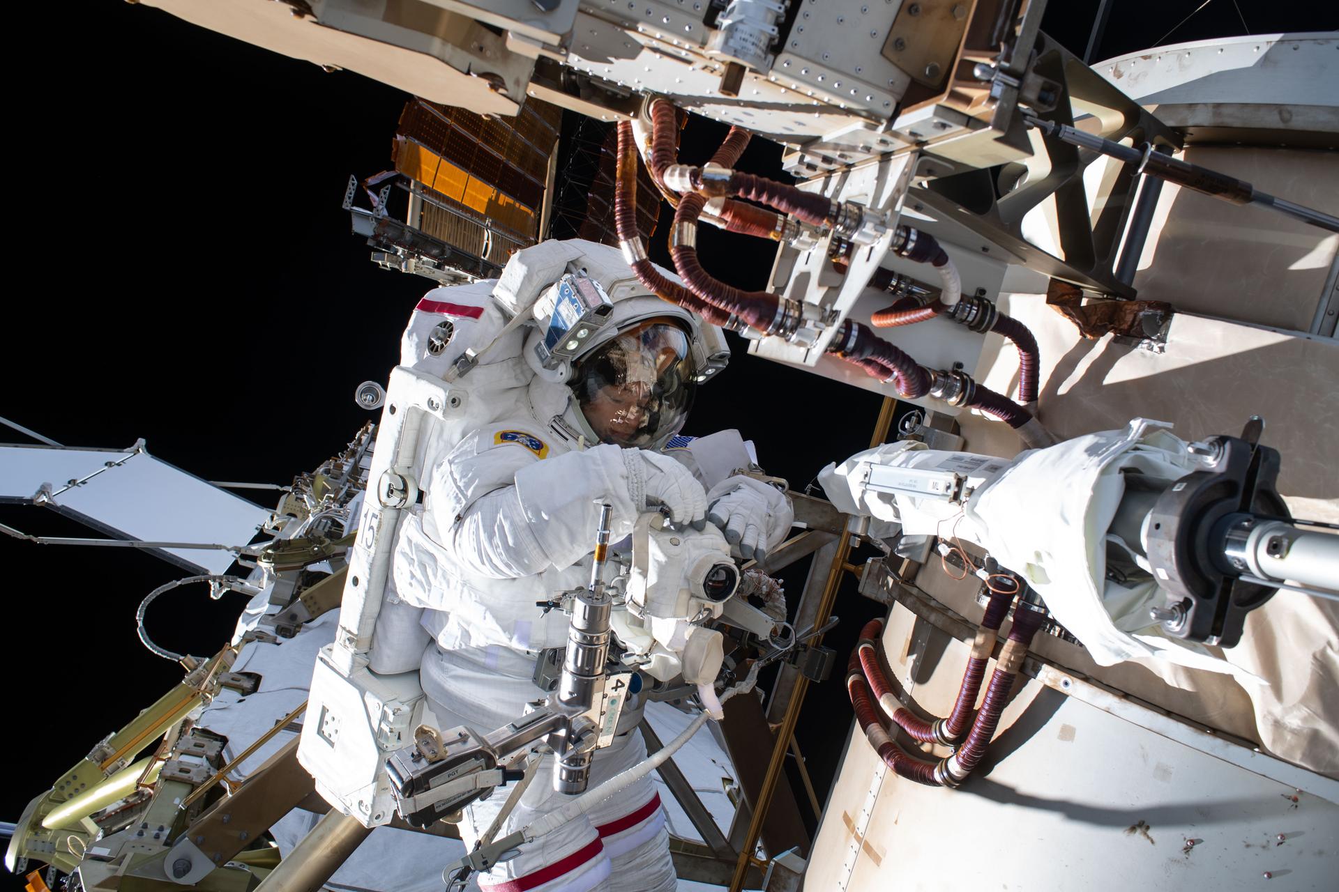 NASA astronaut Jessica Meir installs a roll-out solar array modification kit to the exterior of the International Space Station during the 278th spacewalk in support of space station maintenance, assembly, and upgrades on March 18, 2026.