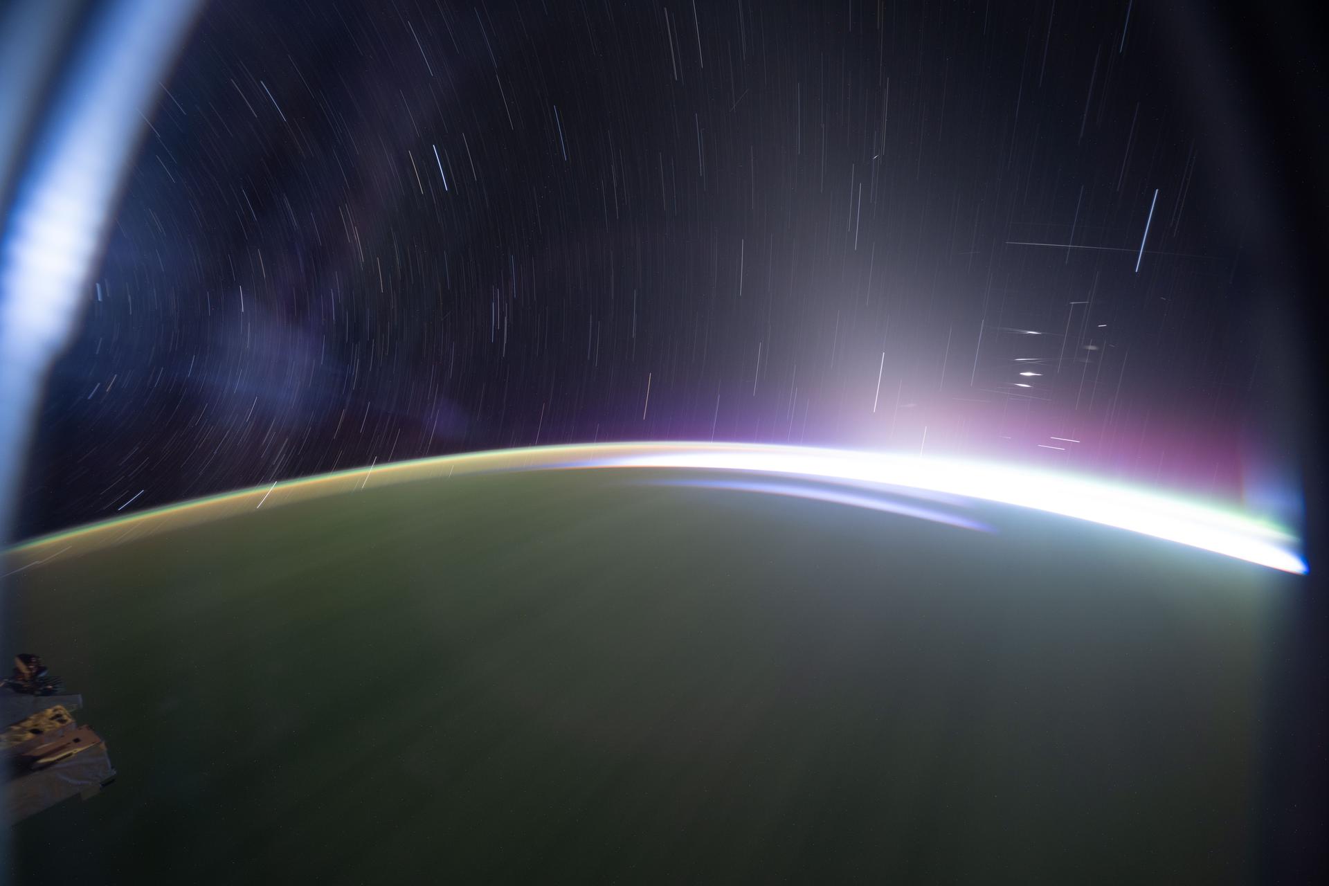 This long-duration photograph, with an exposure of 90 seconds, highlights star trails and an orbital sunrise as the International Space Station soared 268 miles above the southern Indian Ocean at approximately 3:45 a.m. local time.