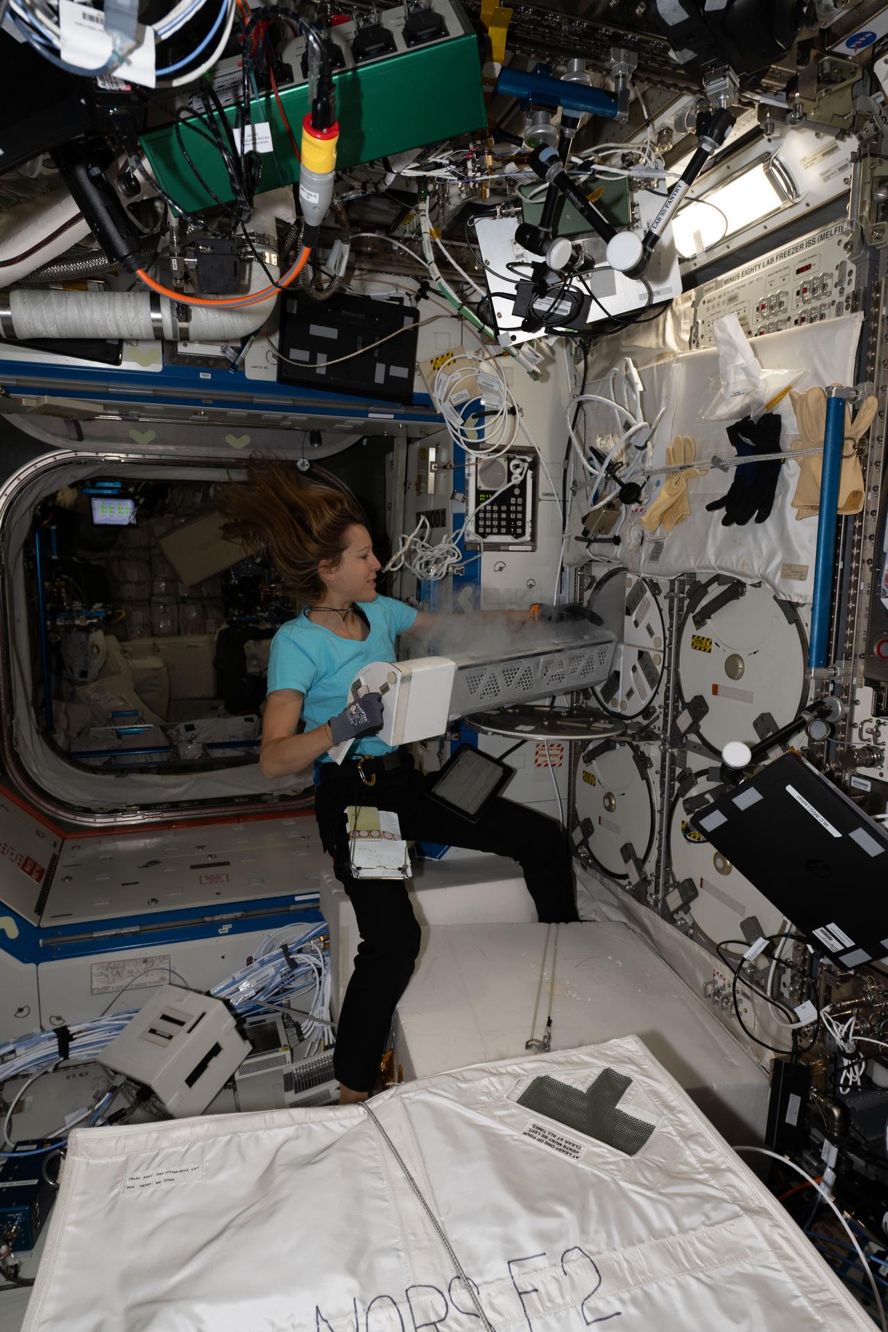 ESA (European Space Agency) astronaut and Expedition 74 flight engineer Sophie Adenot inserts biological research samples into a science freezer inside the International Space Station’s Destiny laboratory module. The freezer, formally known as the Minus Eighty-degree Laboratory Freezer for ISS (MELFI), maintains experiment samples at ultra‑cold temperatures, significantly enhancing microgravity research capabilities and preserving biological specimens for analysis back on Earth.