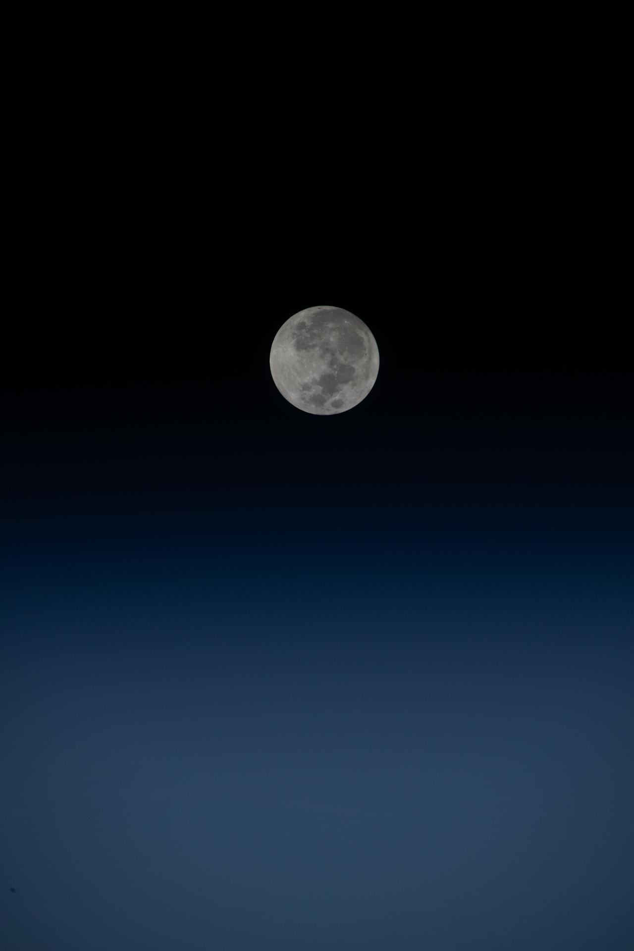 iss074e0431864 (April 1, 2026) --- The waxing gibbous Moon is seen from the International Space Station as the Artemis II mission begins its first day in space, en route to a lunar flyby several days later. Credit: NASA/Chris Williams