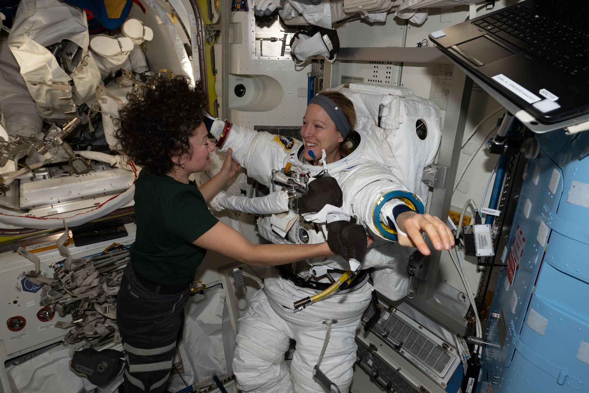 Expedition 74 flight engineers Sophie Adenot of ESA (European Space Agency) and Jessica Meir of NASA work together inside the International Space Station’s Quest airlock. Adenot is wearing a spacesuit in a powered and pressurized configuration to test its mobility, comfort, and optimal fit. Meir also assisted Adenot in conducting suit leak and pressure checks while verifying the suit’s communications hardware and life‑support systems.