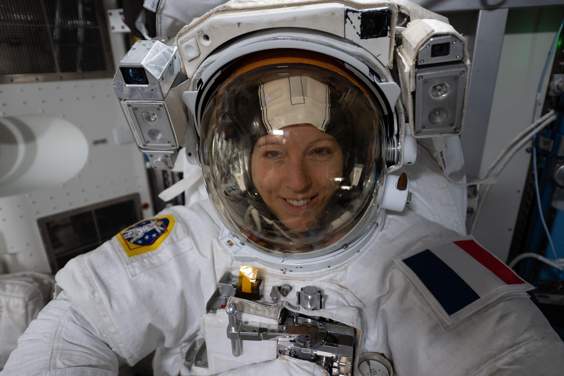 ESA (European Space Agency) astronaut and Expedition 74 flight engineer Sophie Adenot wears a spacesuit in a powered and pressurized configuration to test its mobility, comfort, and optimal fit inside the International Space Station’s Quest airlock. Adenot also conducted suit leak and pressure checks while verifying the suit’s communications hardware and life-support systems.