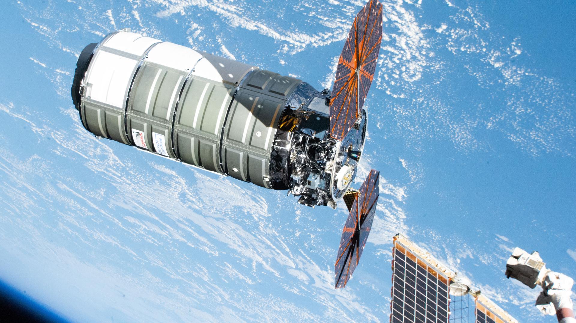 Northrop Grumman's Cygnus XL cargo spacecraft, carrying over 11,000 pounds of new science experiments, lab hardware, and crew supplies, is pictured moments before its capture with the Canadarm2 robotic arm following its approach and rendezvous with the International Space Station.