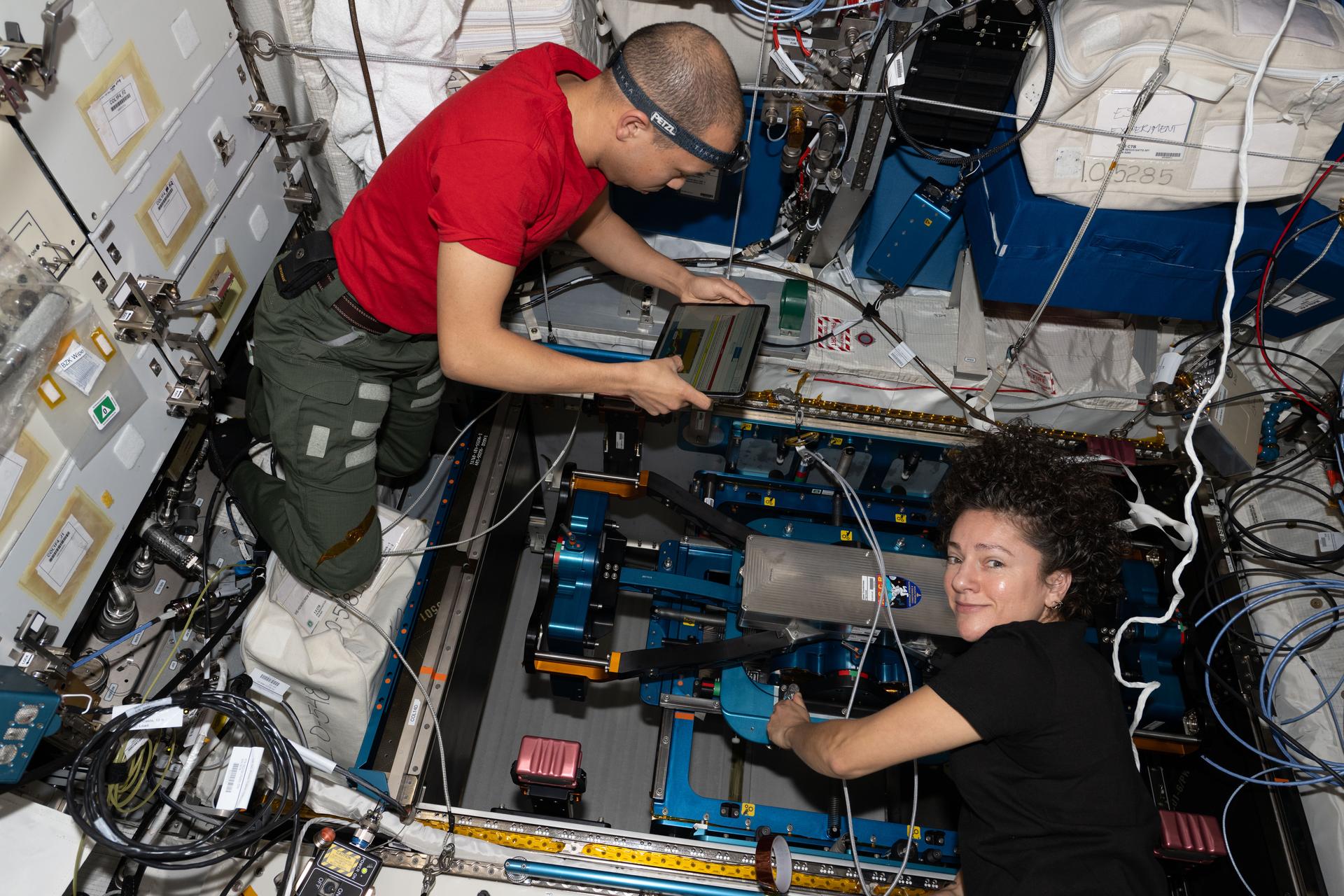 NASA astronauts Chris Williams and Jessica Meir, both Expedition 74 flight engineers, remove and replace components on the European Enhanced Exploration Exercise Device (E4D) to ensure accurate motion, alignment, and long-term system performance. The E4D is being evaluated inside the International Space Station’s Columbus laboratory module for its ability to support crew workouts on missions to the Moon, Mars, and beyond.