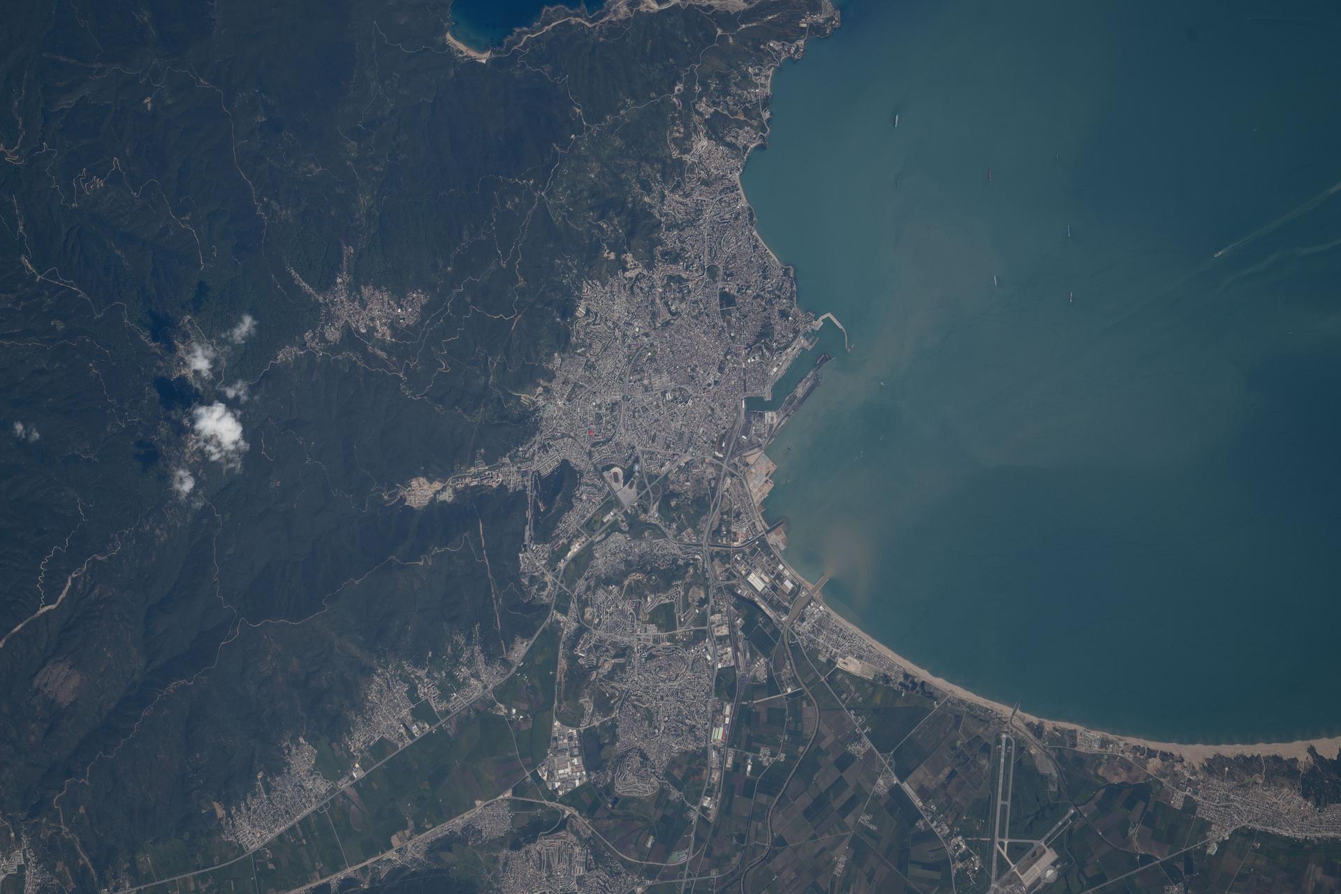 iss074e0491560 (April 19, 2026) --- Annaba, Algeria, located on the coast of the Mediterranean Sea and home to a metropolitan population of about 1 million, is pictured from the International Space Station as it orbited 262 miles above the North African nation. Annaba traces its origins to a Phoenician settlement about 3,200 years ago and features Roman, Byzantine, Moorish, and European architectural influences accumulated over the ensuing centuries. Credit: NASA/Chris Williams