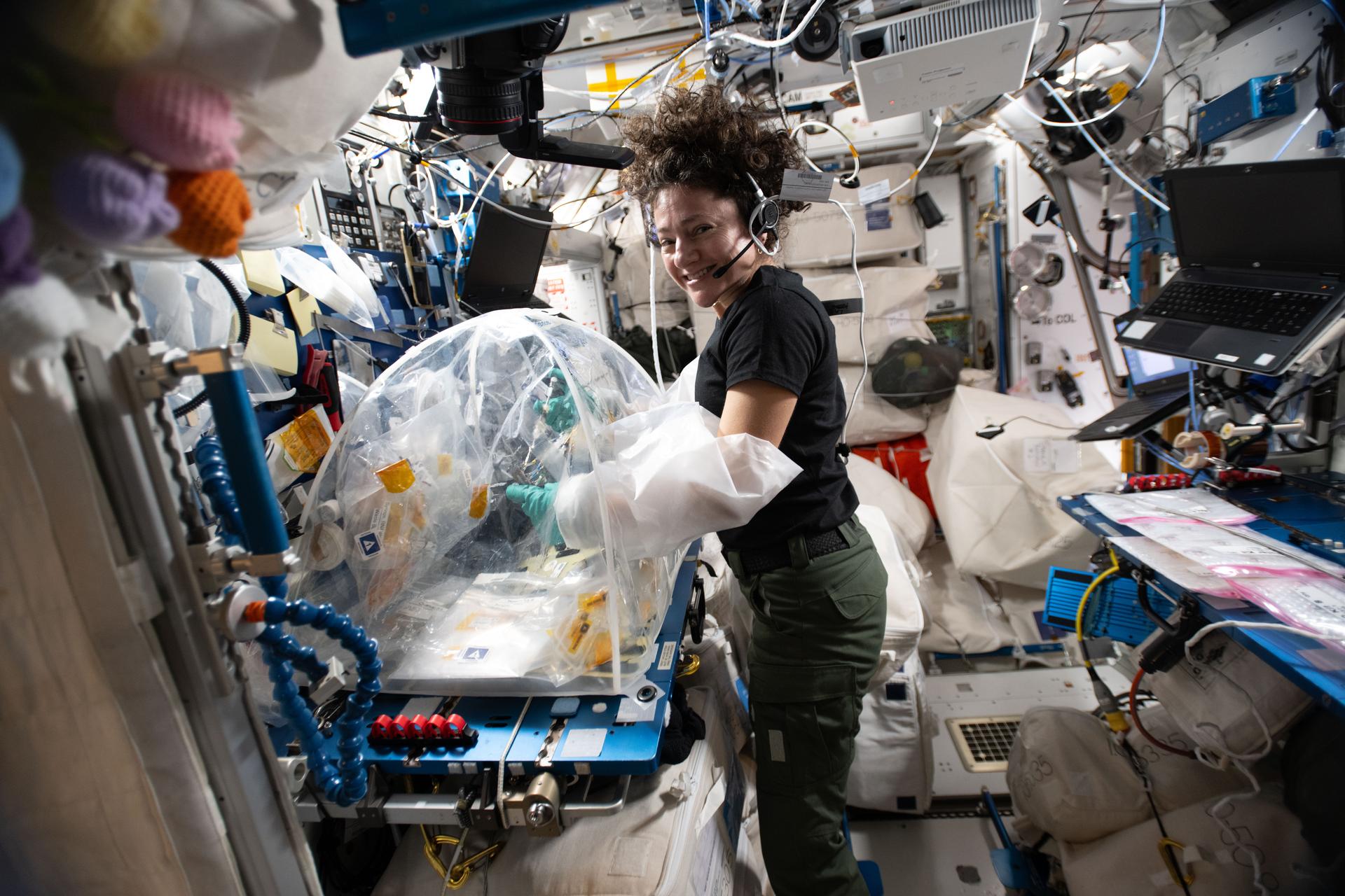 NASA astronaut and Expedition 74 flight engineer Jessica Meir processes samples of heart stem cells and bacteria that cause pneumonia using a portable glovebag inside the International Space Station's Harmony module. Observations in microgravity may give doctors a clearer understanding of how cellular and molecular mechanisms of infectious diseases damage heart tissue, potentially leading to advanced treatments for heart conditions on and off the Earth.