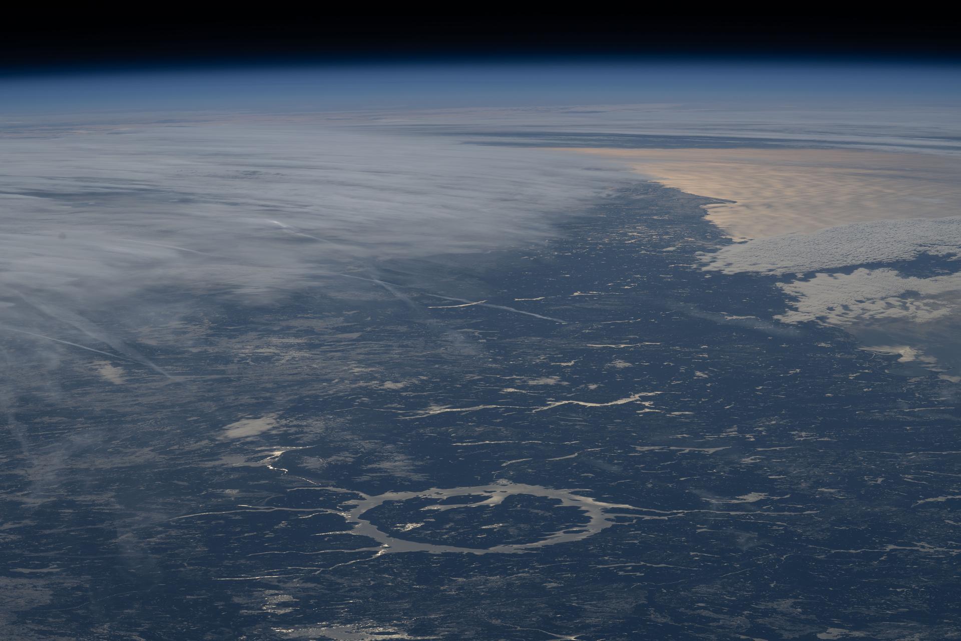 Canada's Manicouagan Crater, located in the province of Quebec, is a massive meteorite impact structure formed about 214 million years ago and is one of the largest craters on Earth. The ring‑shaped lake surrounding the crater, known as the Manicouagan Reservoir, is part of a major hydroelectric system that contributes significantly to the region's energy supply.