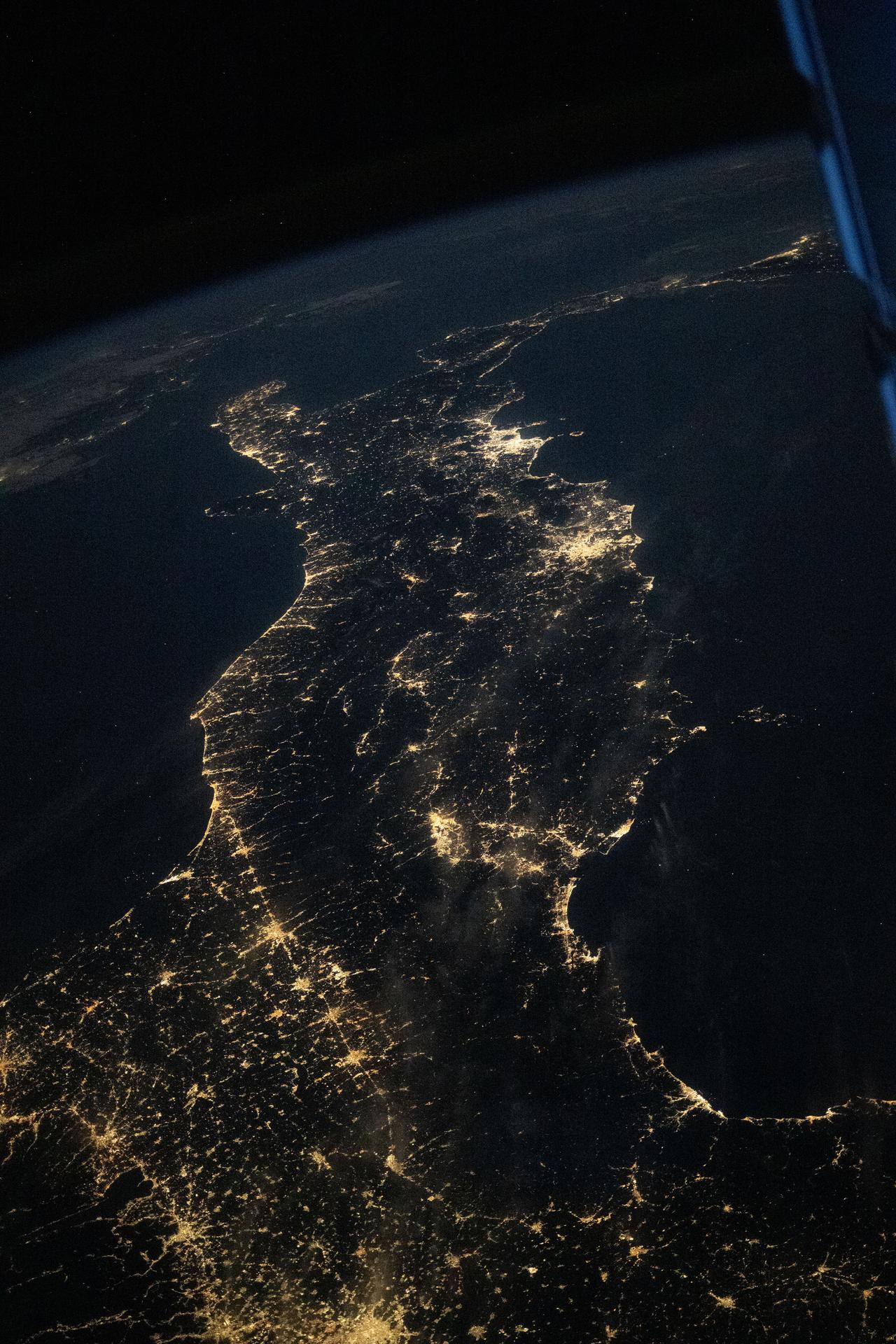 This nighttime image of Italy looks southward toward the Mediterranean Sea and is outlined by its coastal city lights, including those of Rome and Naples near the upper center. The International Space Station was orbiting 262 miles above southern Germany at the time of this photograph.