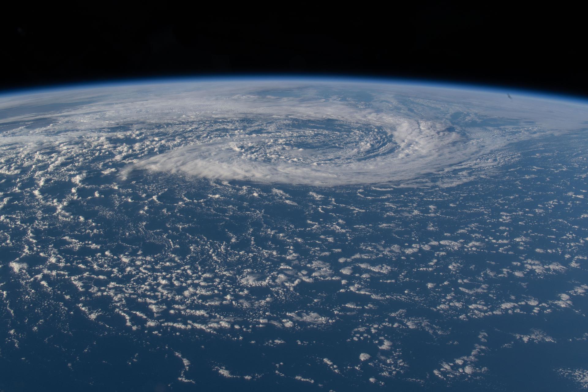 A mesoscale low‑pressure system is pictured spinning in the South Pacific Ocean, creating significant swells in the surrounding waters just off the coast of Chile's Patagonia region in this photograph from the International Space Station as it orbited 273 miles above Earth. A mesoscale low‑pressure system is a small to medium‑sized area of lower air pressure—larger than a thunderstorm but smaller than a big weather system—that can create its own local wind, cloud, and precipitation patterns.