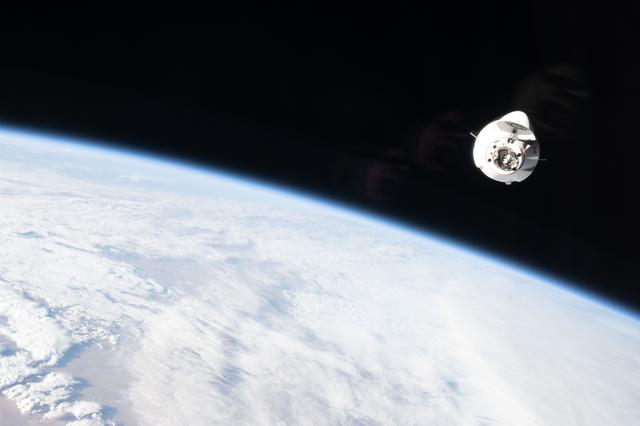 A SpaceX Dragon cargo spacecraft approaches the International Space Station