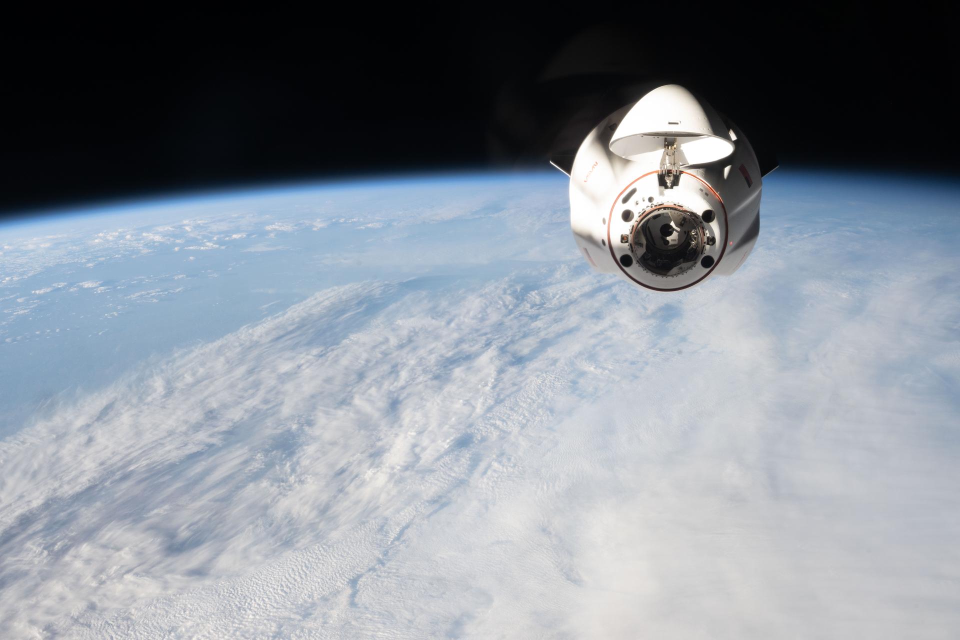 A SpaceX Dragon cargo spacecraft, with its nose cone open to reveal its docking mechanism, approaches the International Space Station carrying nearly 6,500 pounds of food, supplies, and equipment for the Expedition 74 crew. This mission marked SpaceX’s 34th commercial resupply services flight to the space station for NASA.