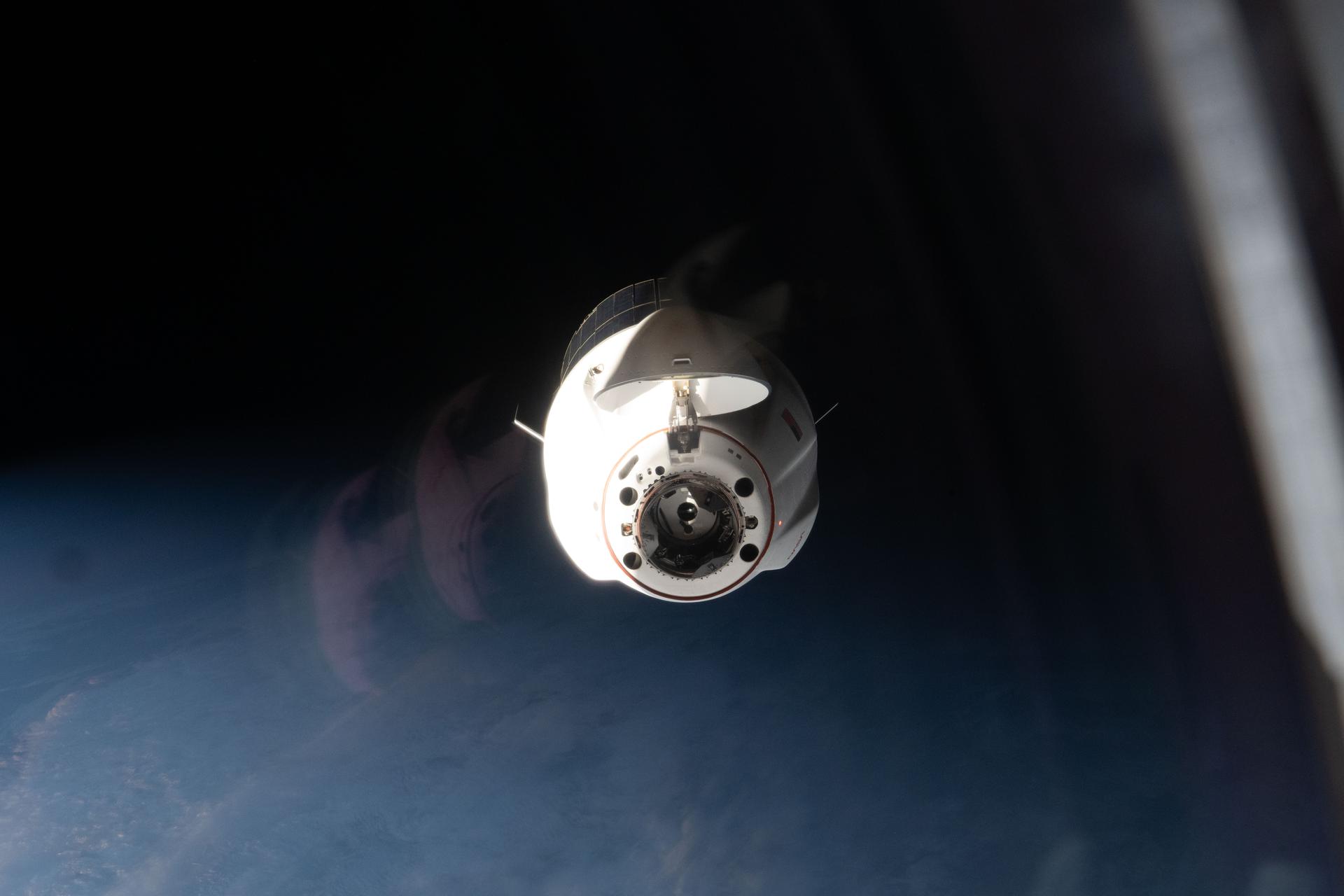 A SpaceX Dragon cargo spacecraft, with its nose cone open to reveal its docking mechanism, approaches the International Space Station carrying nearly 6,500 pounds of food, supplies, and equipment for the Expedition 74 crew. This mission marked SpaceX’s 34th commercial resupply services flight to the space station for NASA.