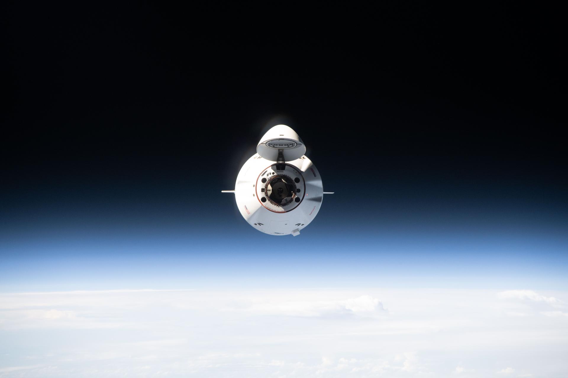 A SpaceX Dragon cargo spacecraft, with its nose cone open to reveal its docking mechanism, approaches the International Space Station carrying nearly 6,500 pounds of food, supplies, and equipment for the Expedition 74 crew. This mission marked SpaceX’s 34th commercial resupply services flight to the space station for NASA.