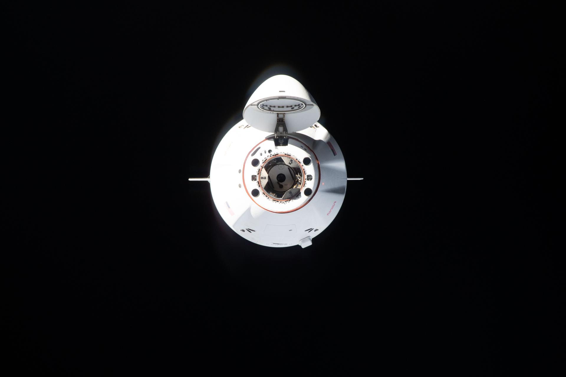 A SpaceX Dragon cargo spacecraft, with its nose cone open to reveal its docking mechanism, approaches the International Space Station carrying nearly 6,500 pounds of food, supplies, and equipment for the Expedition 74 crew. This mission marked SpaceX’s 34th commercial resupply services flight to the space station for NASA.