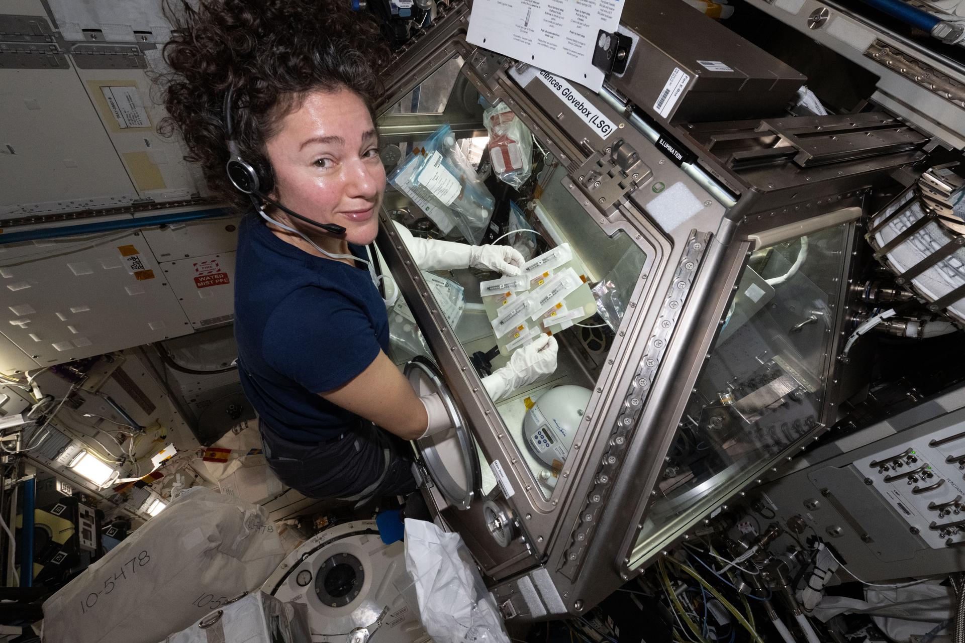 NASA astronaut and Expedition 74 flight engineer Jessica Meir works inside the Kibo laboratory module’s Life Science Glovebox aboard the International Space Station. Meir was preparing blood‑making cell samples—blood platelets—for incubation and growth to observe how weightlessness affects a crew member’s blood clotting and immune function at the cellular and genetic levels.