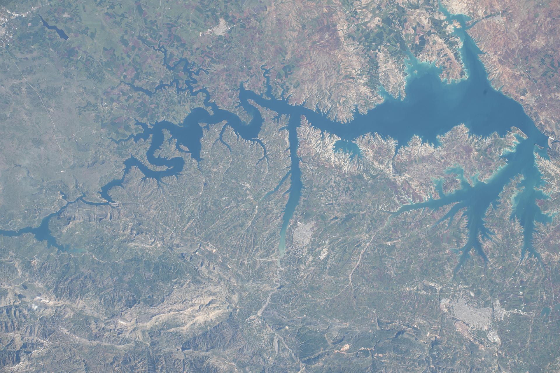 The Atatürk Dam, built on the Euphrates River in Turkey, expanded the nation’s water supply, increasing agricultural productivity and boosting hydroelectric power production, which has promoted growth and development throughout the region. The International Space Station was orbiting 259 miles above Earth at the time of this photograph.