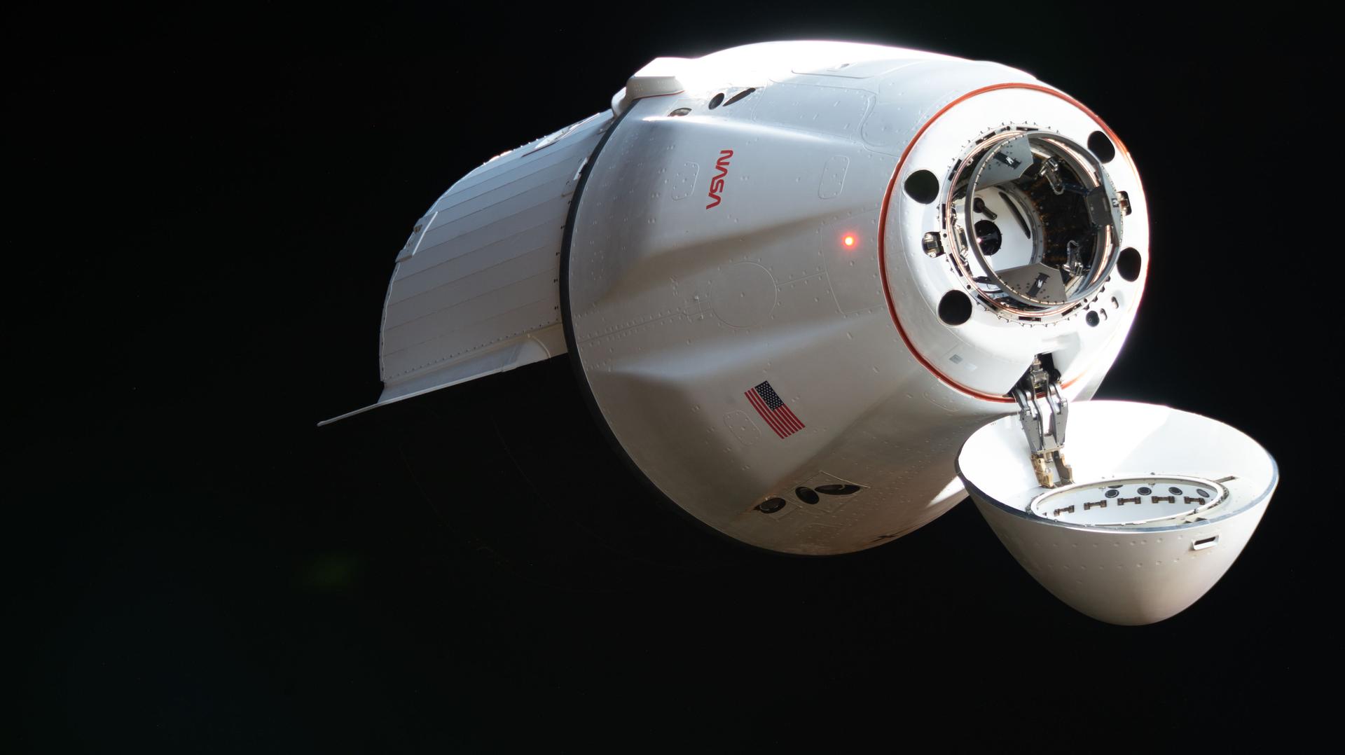 A SpaceX Dragon cargo spacecraft, with its nose cone open to reveal its docking mechanism, approaches the International Space Station carrying nearly 6,500 pounds of food, supplies, and equipment for the Expedition 74 crew. This mission marked SpaceX’s 34th commercial resupply services flight to the space station for NASA.