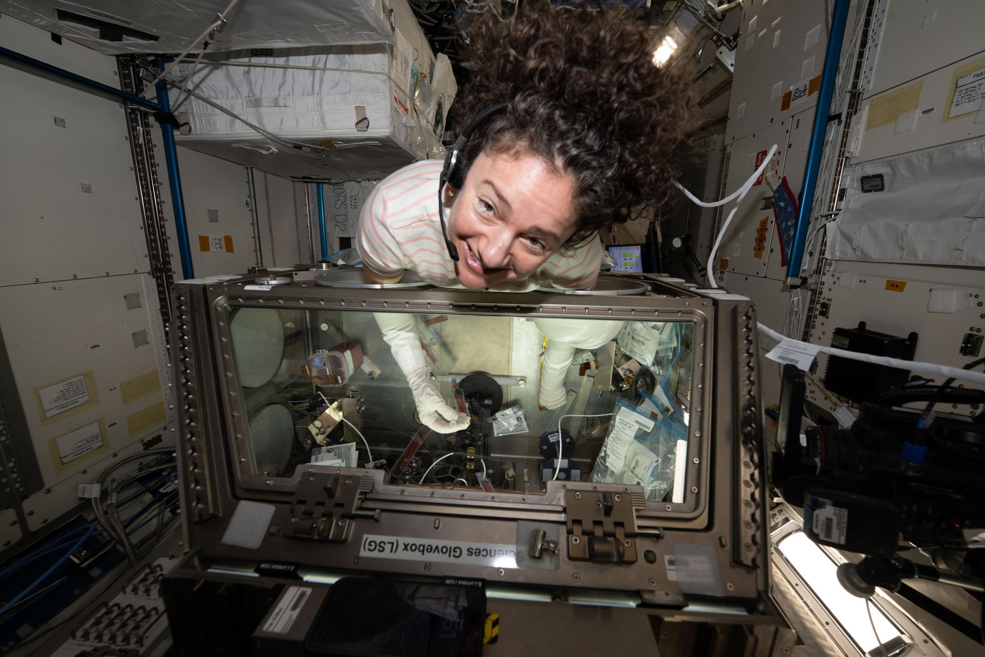 NASA astronaut and Expedition 74 flight engineer Jessica Meir nourishes stem cell samples inside the Kibo laboratory module’s Life Science Glovebox aboard the International Space Station. The stem cell samples were incubated to help researchers learn how to manufacture space‑designed therapies to treat cancer and blood disorders.