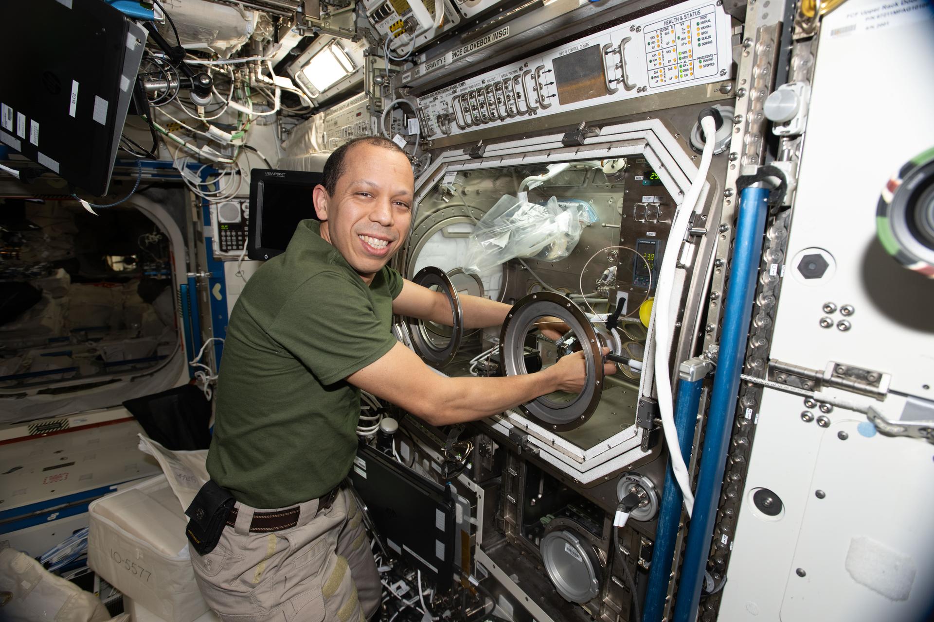 NASA astronaut and Expedition 74 Flight Engineer Chris Williams replaces sample hardware inside the Destiny laboratory module’s Microgravity Science Glovebox aboard the International Space Station to support semiconductor crystal research. Growing crystals in weightlessness may enable future large-scale semiconductor manufacturing, advancing the commercial space economy and supporting Earth-based industries.