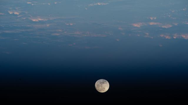 A Waxing Gibbous Moon is pictured above the Pacific Ocean